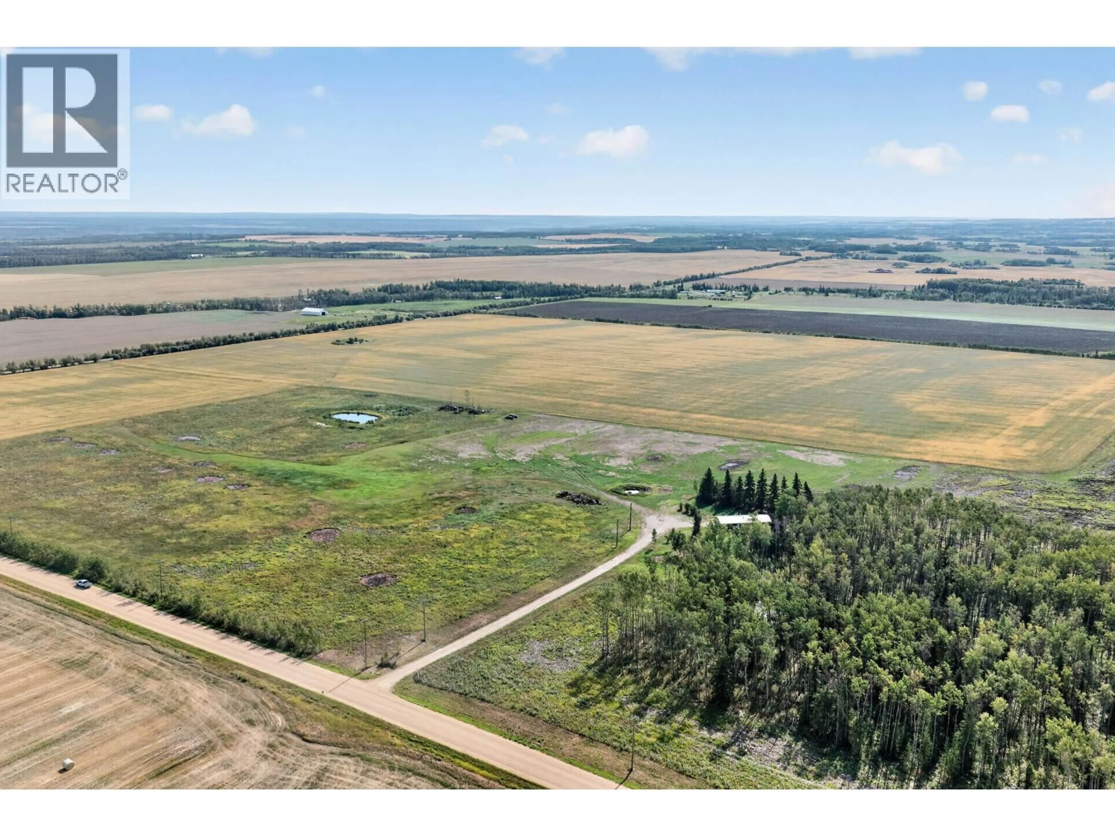 A pic from outside/outdoor area/front of a property/back of a property/a pic from drone, water/lake/river/ocean view for 7725 264 ROAD, Fort St. John British Columbia V0C1Y0