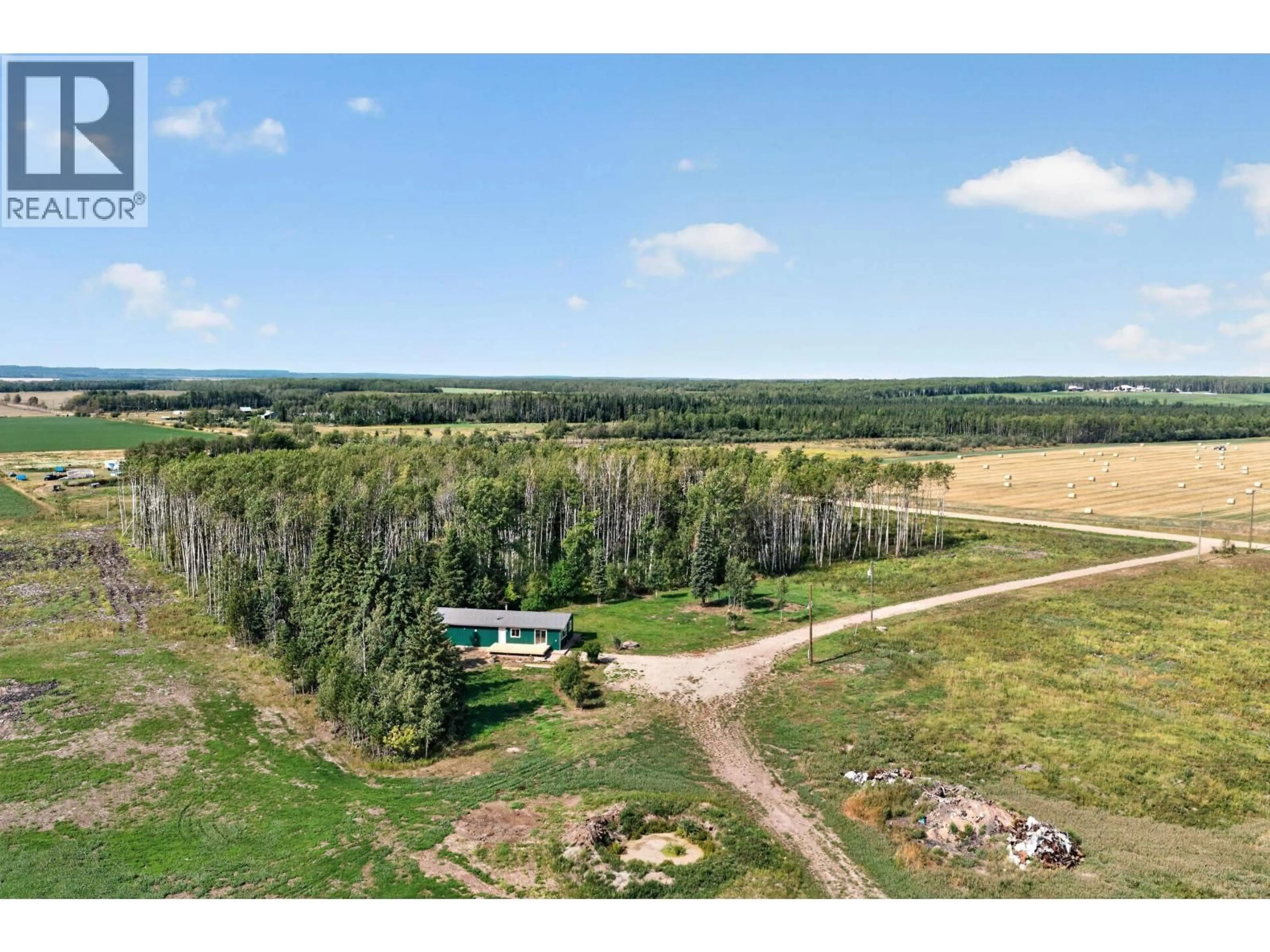 A pic from outside/outdoor area/front of a property/back of a property/a pic from drone, forest/trees view for 7725 264 ROAD, Fort St. John British Columbia V0C1Y0