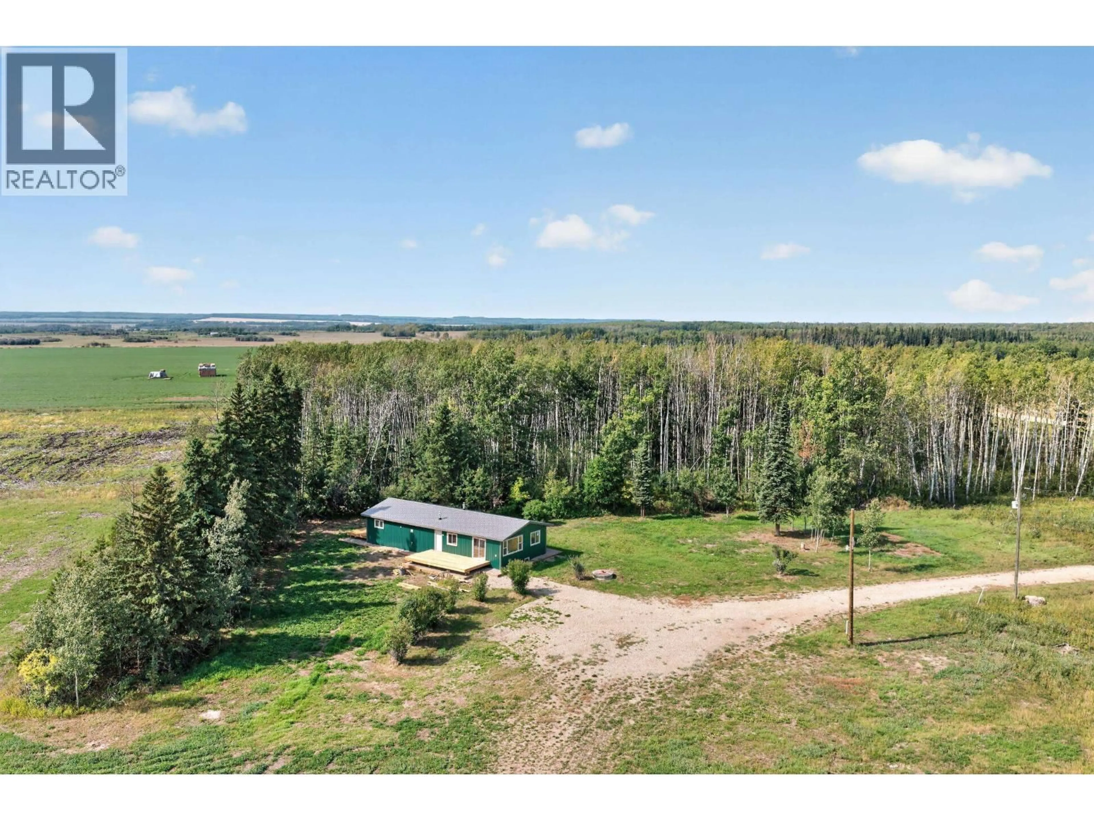 A pic from outside/outdoor area/front of a property/back of a property/a pic from drone, unknown for 7725 264 ROAD, Fort St. John British Columbia V0C1Y0