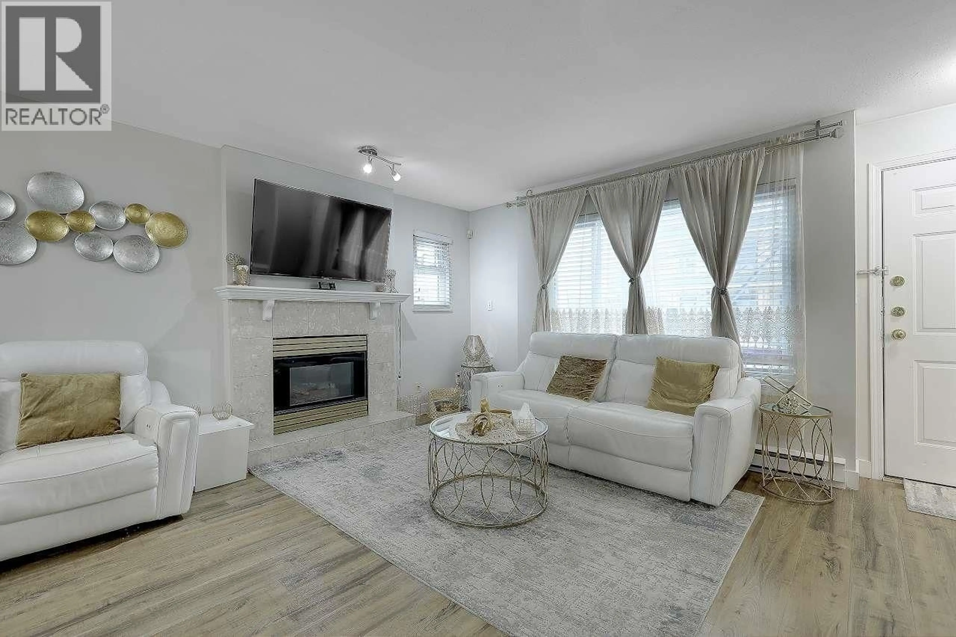 Living room with furniture, wood/laminate floor for 209 - 3978 ALBERT STREET, Burnaby British Columbia V5C2E1