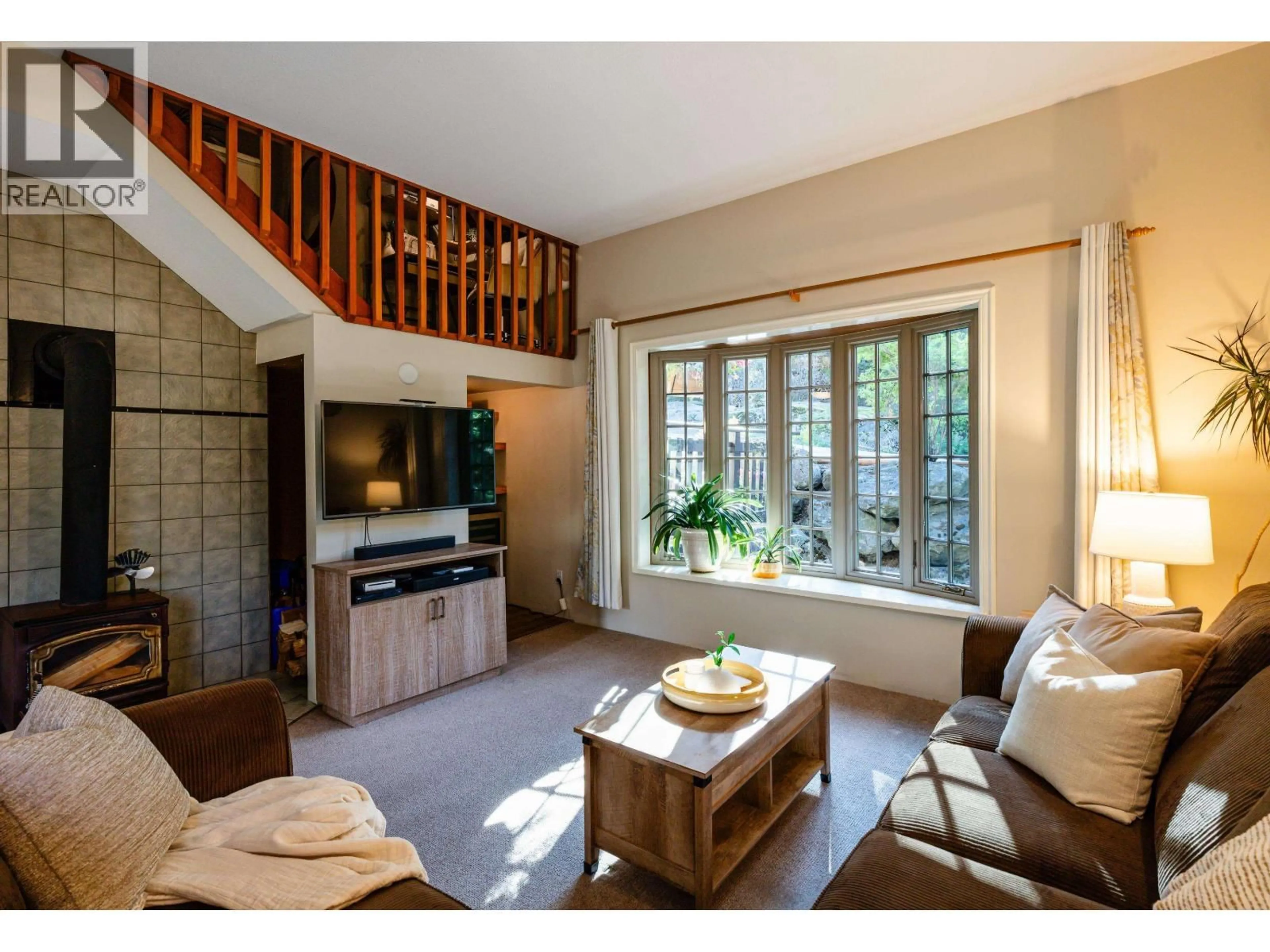 Living room with furniture, wood/laminate floor for 9167 EMERALD DRIVE, Whistler British Columbia V8E0G5