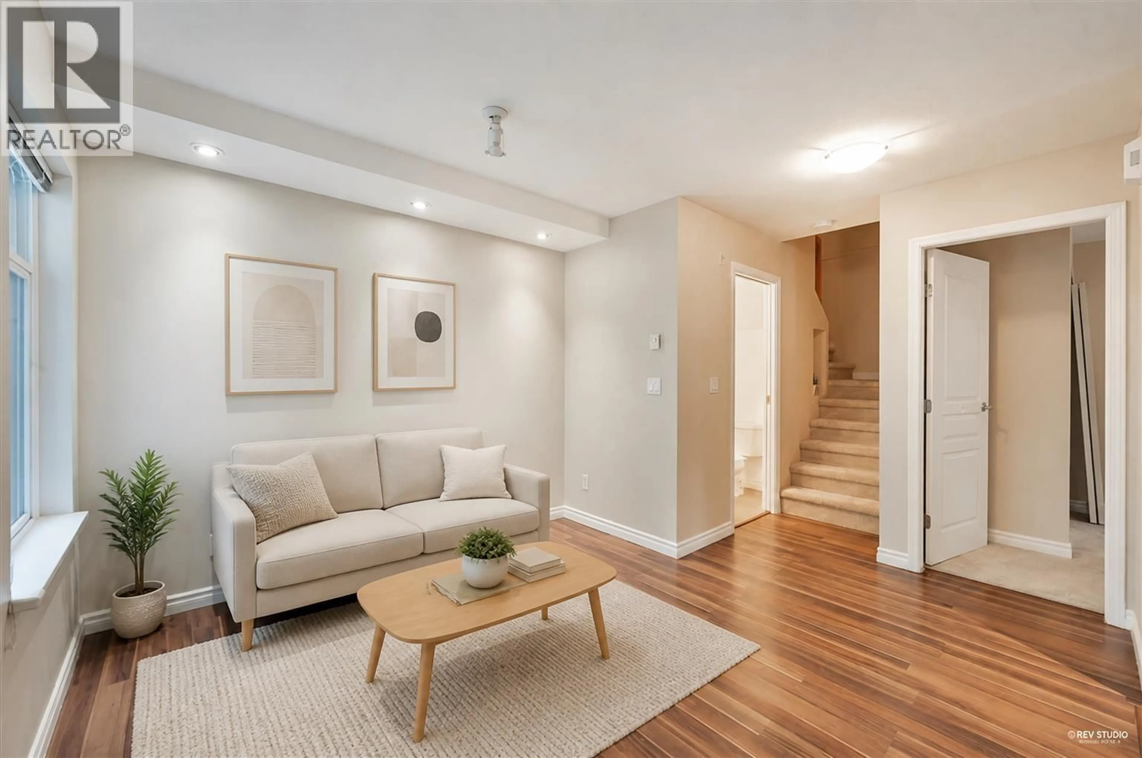 Living room with furniture, wood/laminate floor for 17 - 7488 SOUTHWYNDE AVENUE, Burnaby British Columbia V3N5C6
