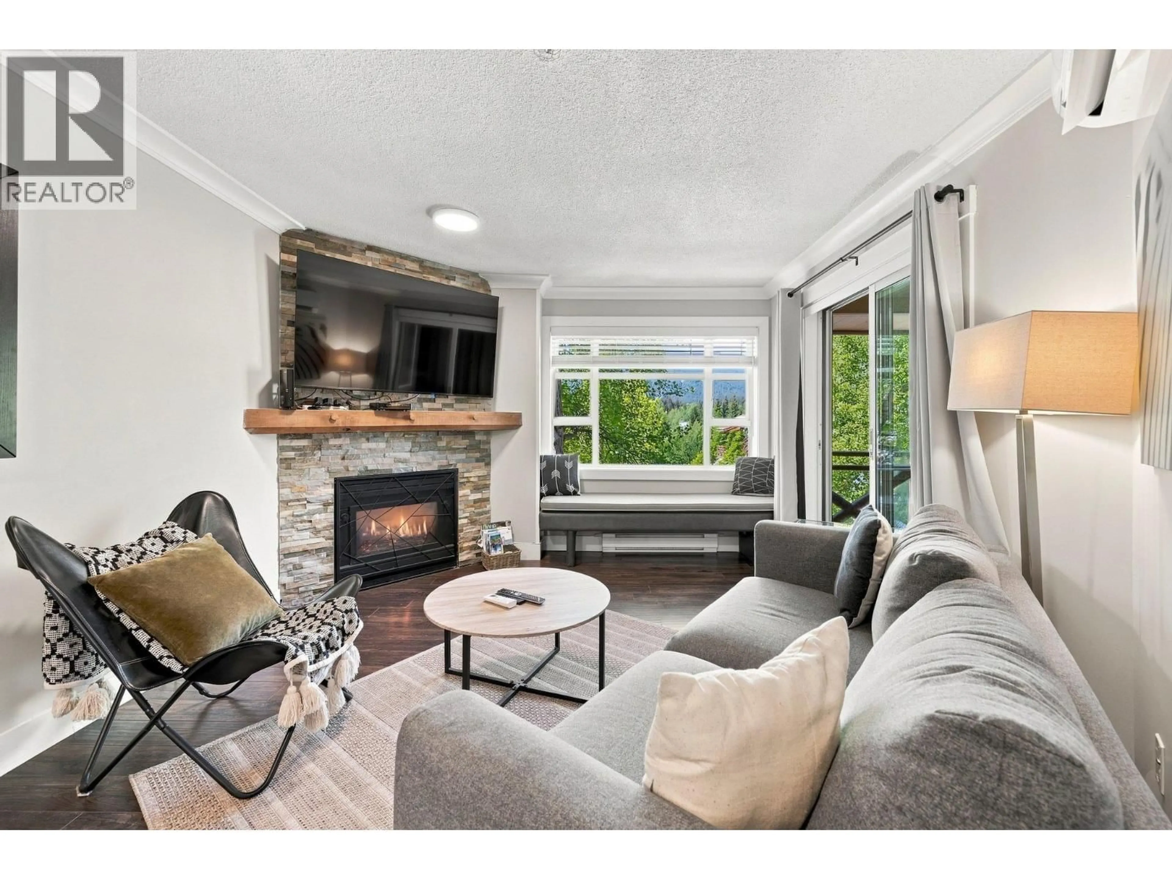 Living room with furniture, wood/laminate floor for 324 - 4360 LORIMER ROAD, Whistler British Columbia V8E1A5