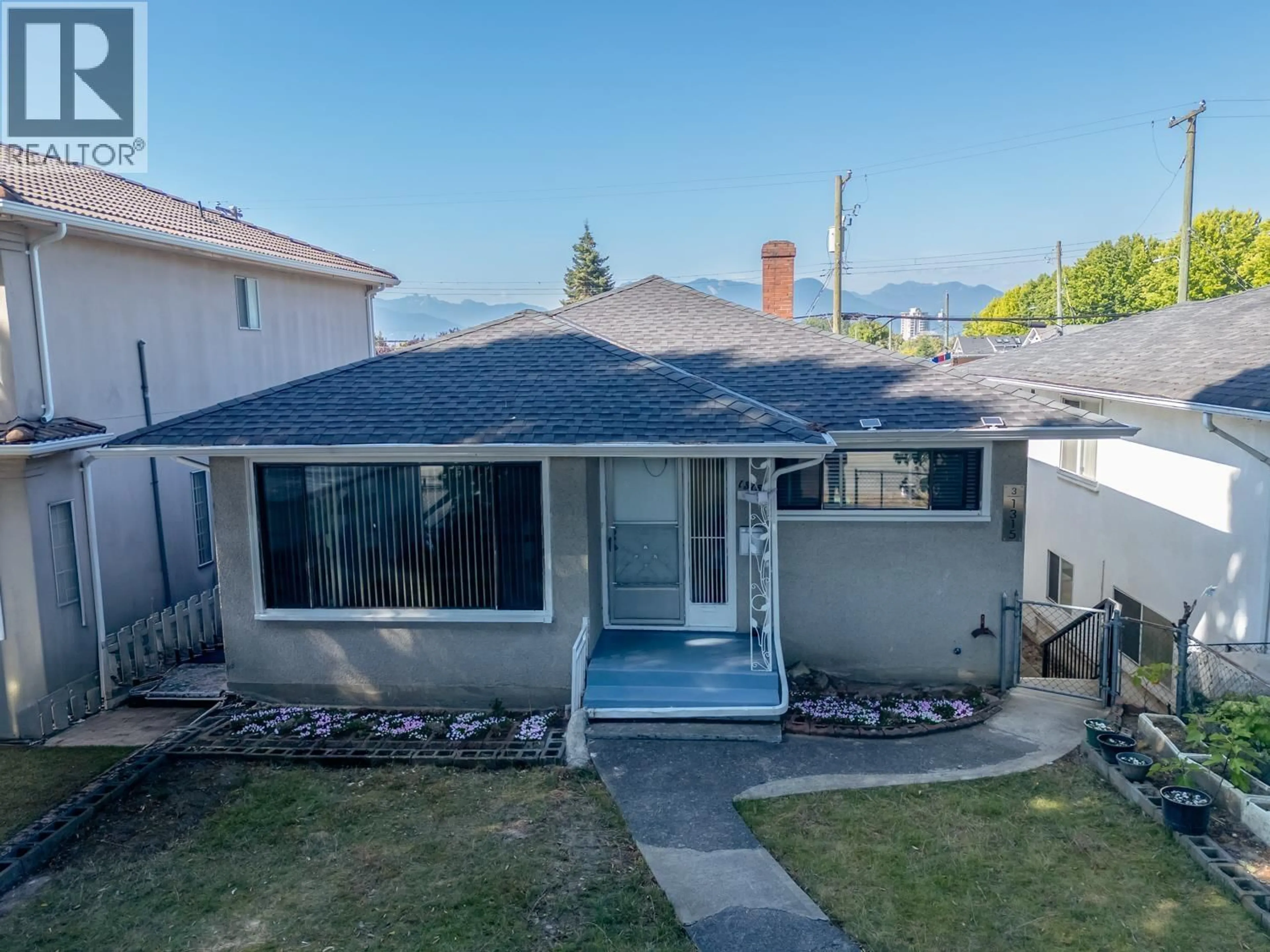 A pic from outside/outdoor area/front of a property/back of a property/a pic from drone, street for 1315 33RD AVENUE, Vancouver British Columbia V5V3B8