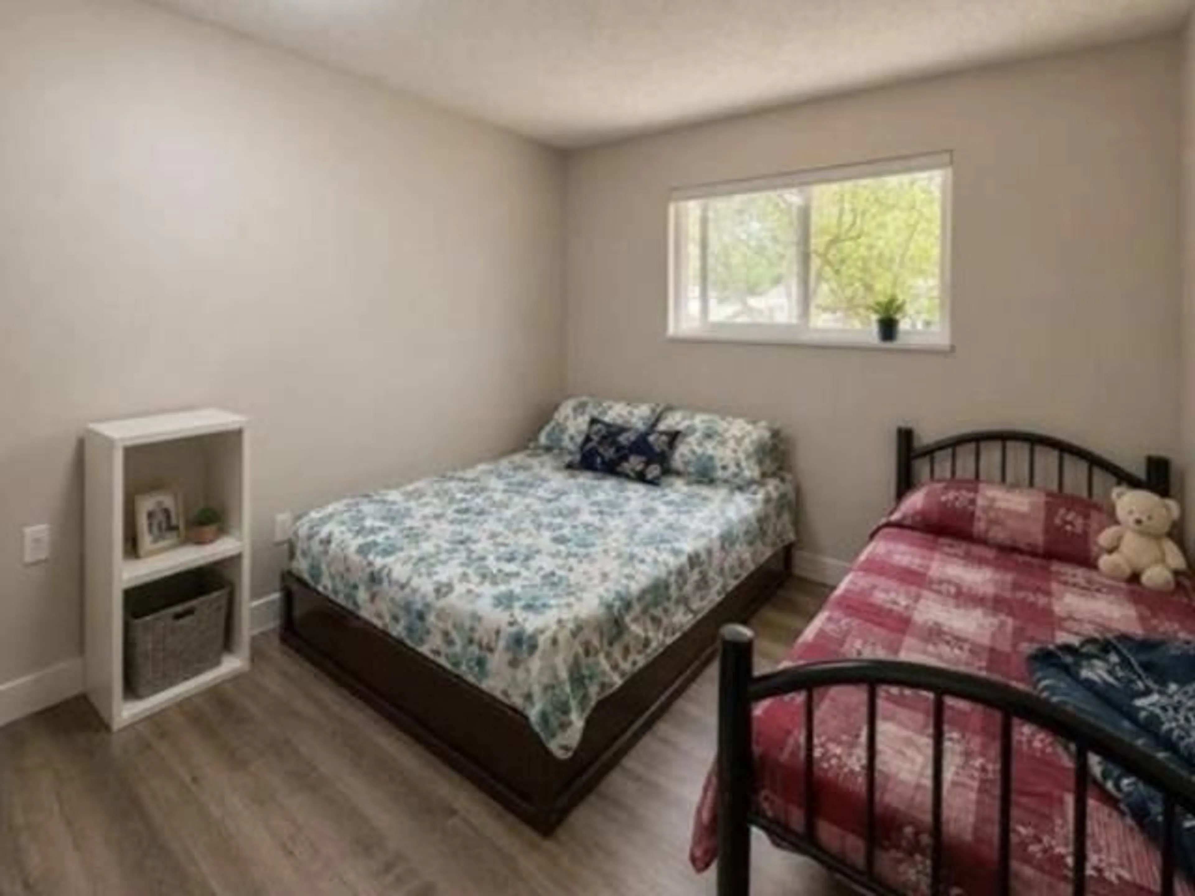 Bedroom with bed, wood/laminate floor for 14565 91A AVENUE, Surrey British Columbia V3R7K6