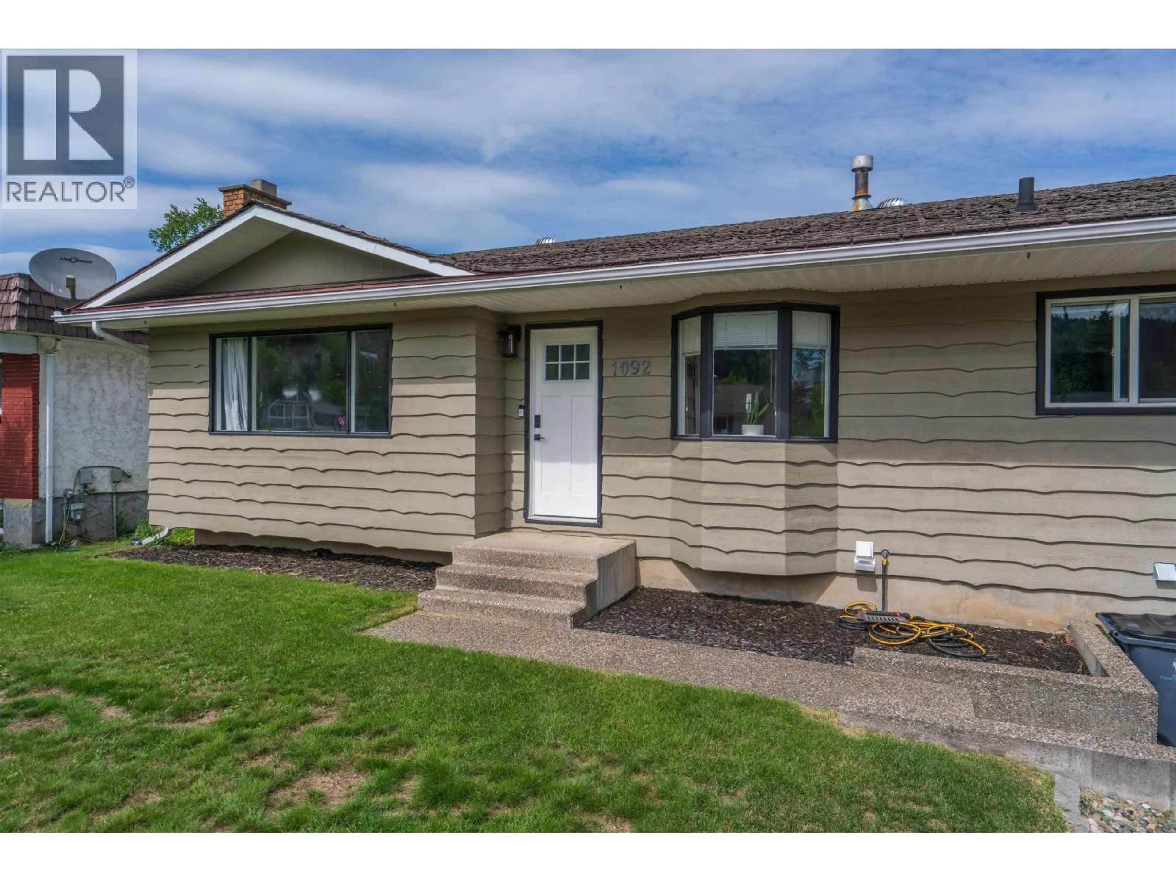 Home with vinyl exterior material, street for 1092 LIMESTONE CRESCENT, Prince George British Columbia V2M4Z2