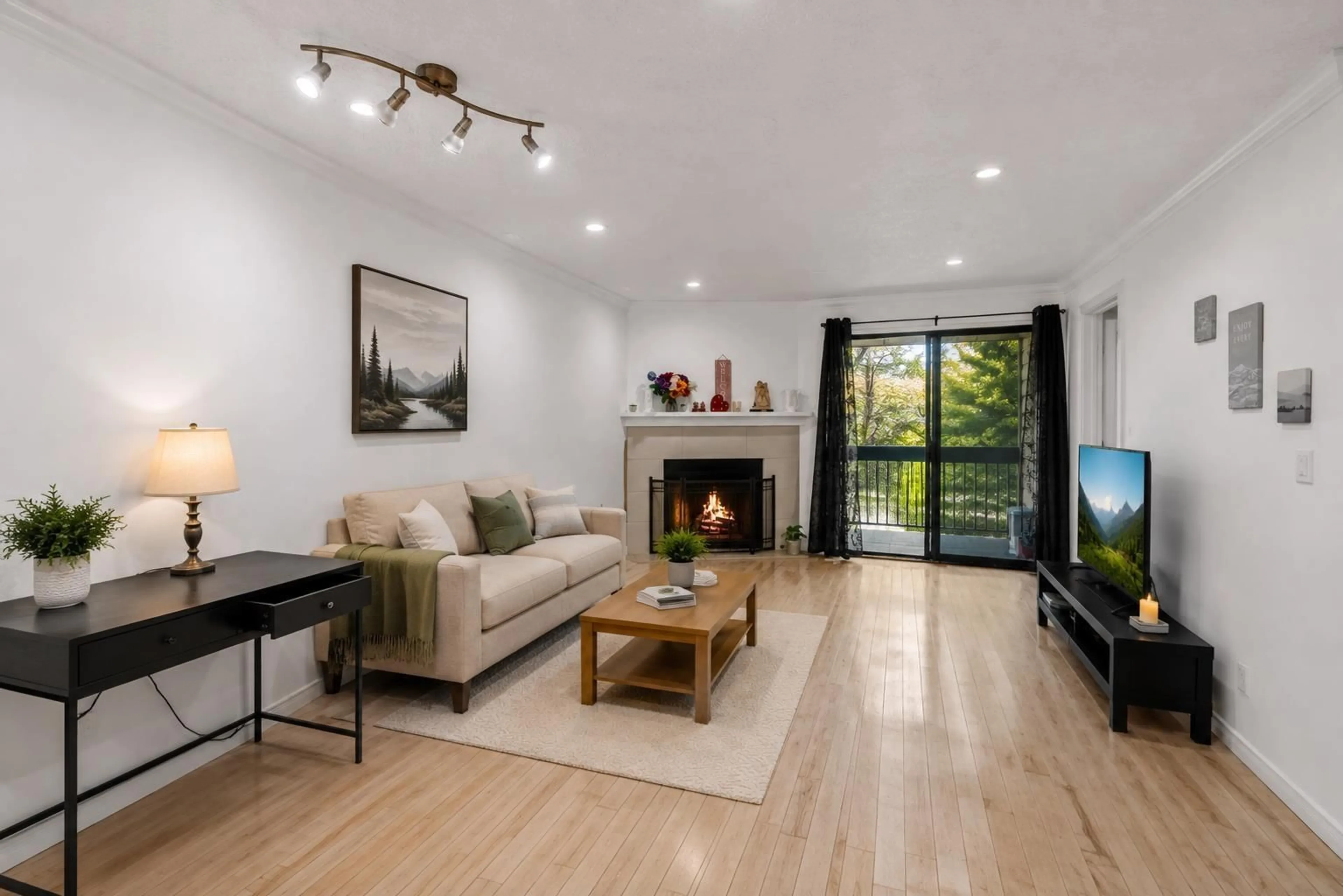 Living room with furniture, wood/laminate floor for 201 - 10560 154 STREET, Surrey British Columbia V3R8A3