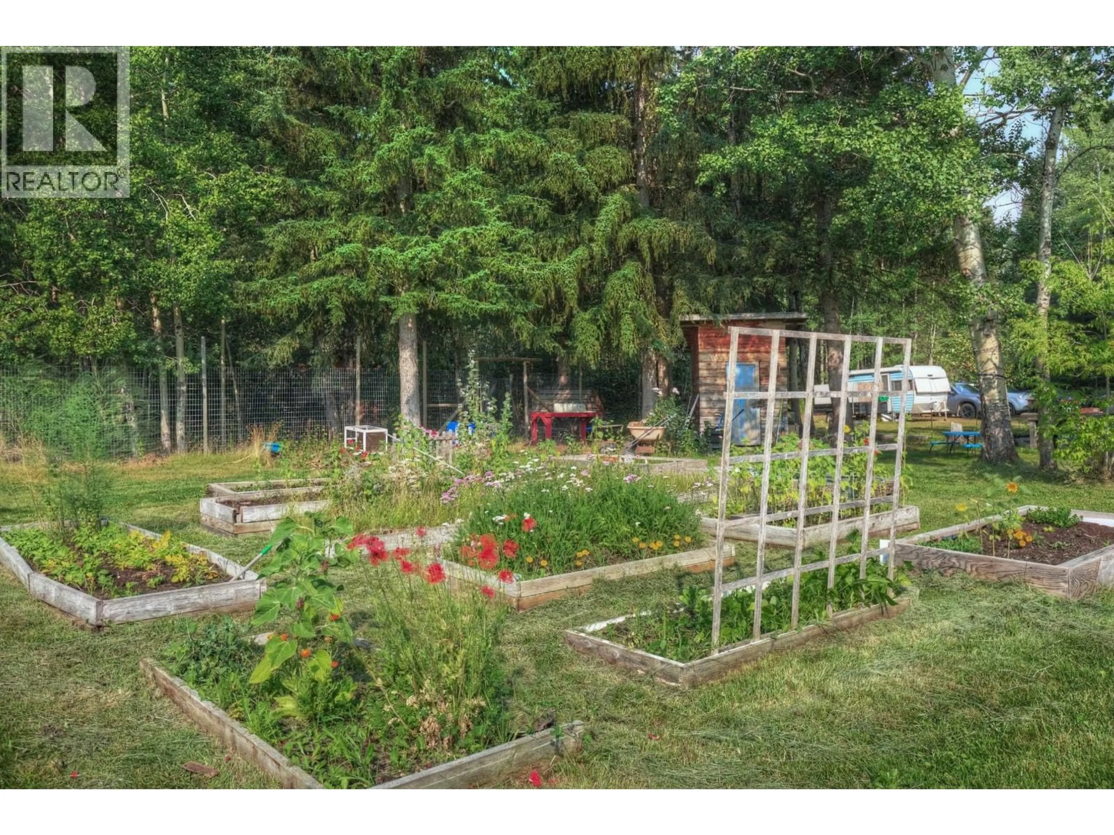 A pic from outside/outdoor area/front of a property/back of a property/a pic from drone, forest/trees view for 2211 DOYLE ROAD, 150 Mile House British Columbia V0K2G0