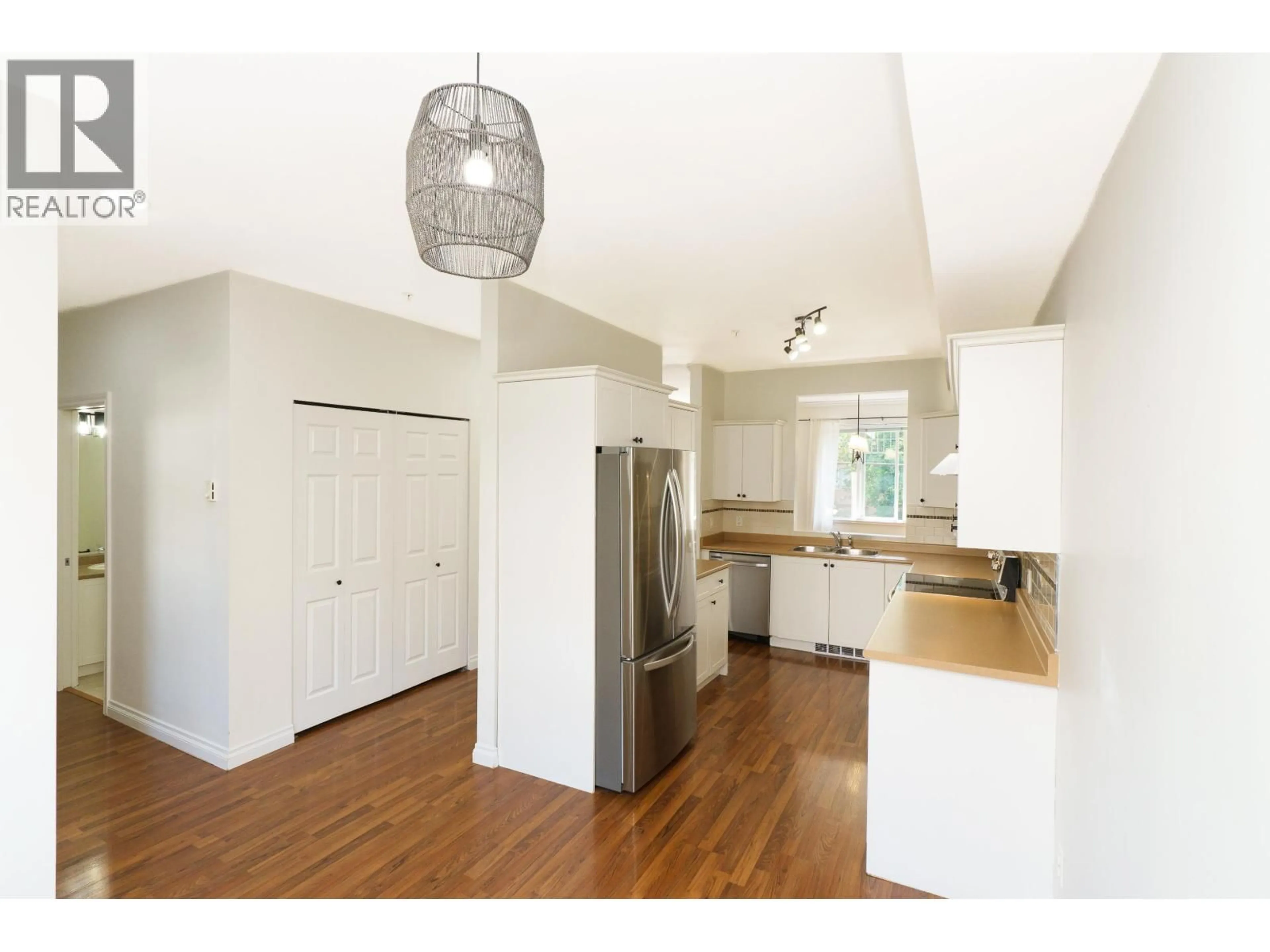 Open concept kitchen, wood/laminate floor for 206 - 1567 GRANT AVENUE, Port Coquitlam British Columbia V3B1P1