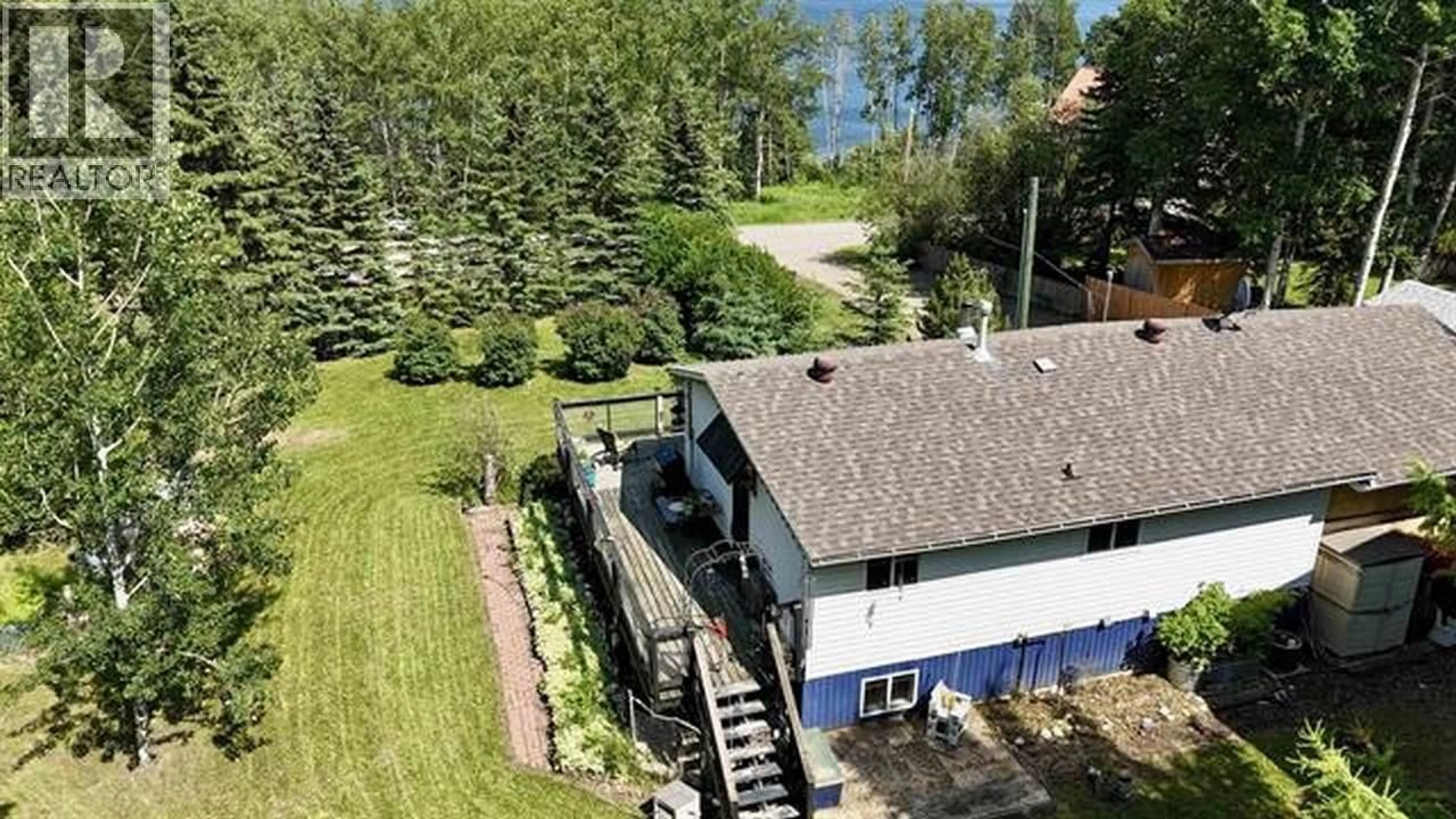 A pic from outside/outdoor area/front of a property/back of a property/a pic from drone, water/lake/river/ocean view for 13390 CHARLIE LAKE CRESCENT, Charlie Lake British Columbia V1J8G3