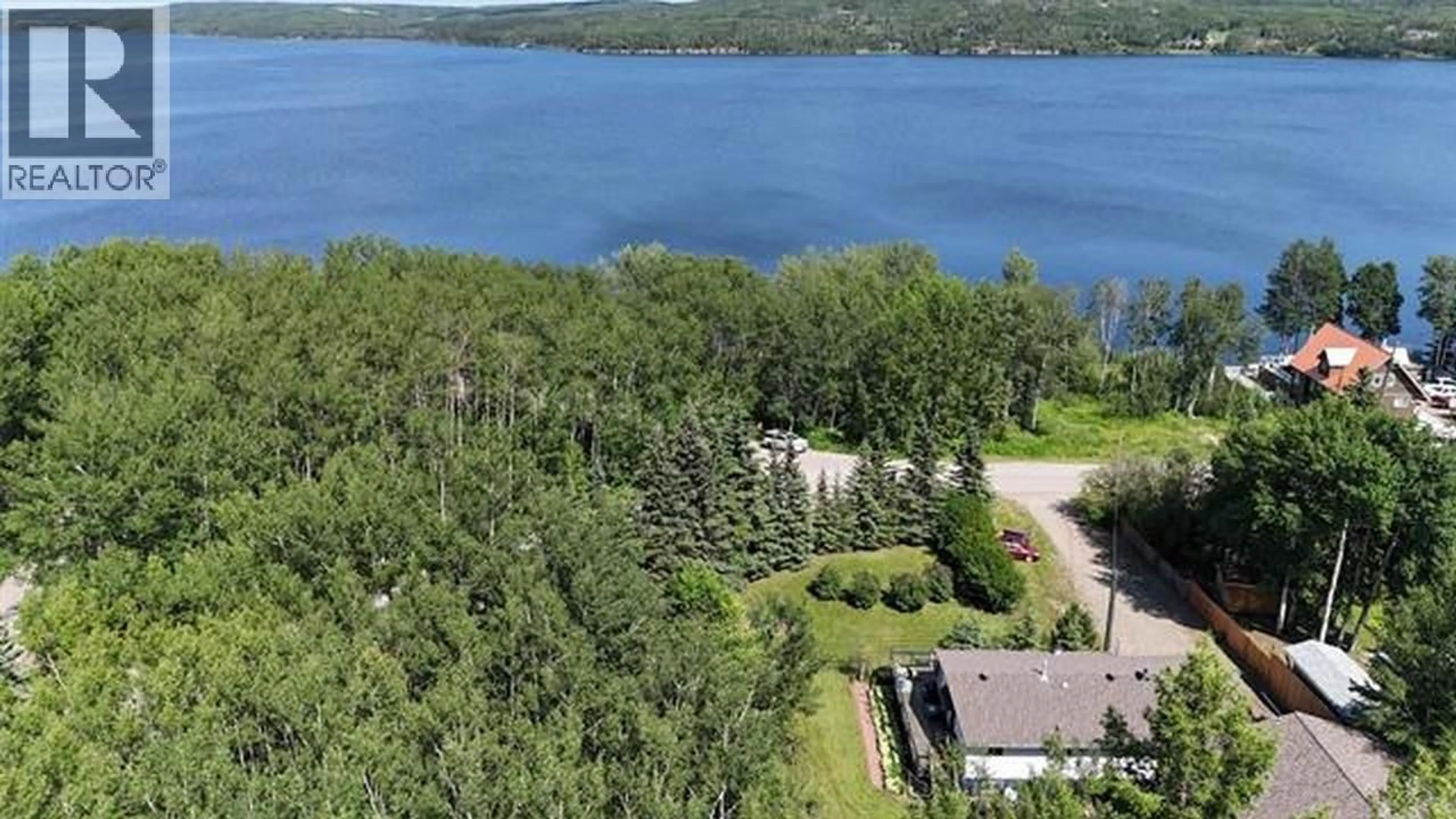 A pic from outside/outdoor area/front of a property/back of a property/a pic from drone, water/lake/river/ocean view for 13390 CHARLIE LAKE CRESCENT, Charlie Lake British Columbia V1J8G3