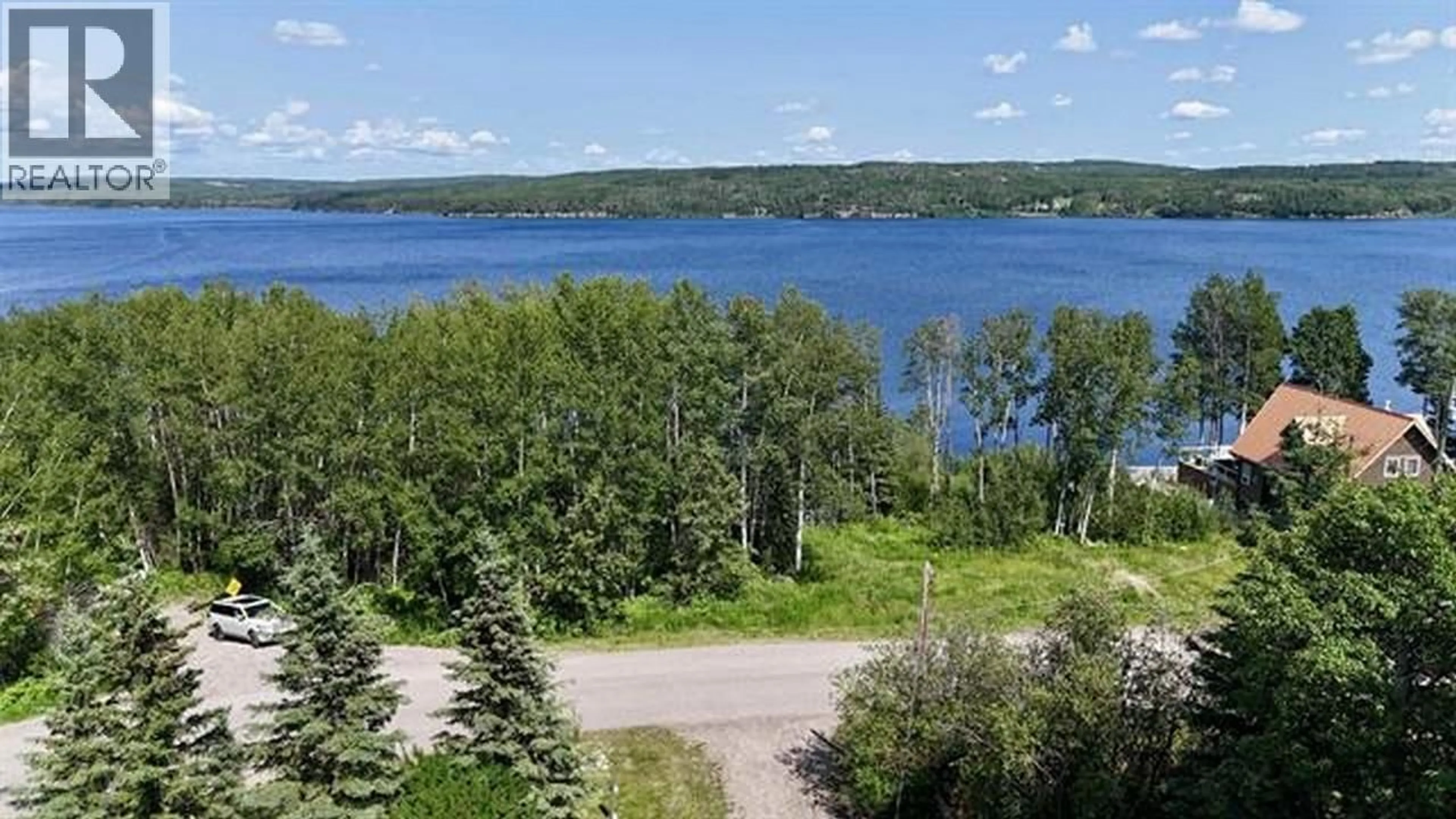A pic from outside/outdoor area/front of a property/back of a property/a pic from drone, water/lake/river/ocean view for 13390 CHARLIE LAKE CRESCENT, Charlie Lake British Columbia V1J8G3