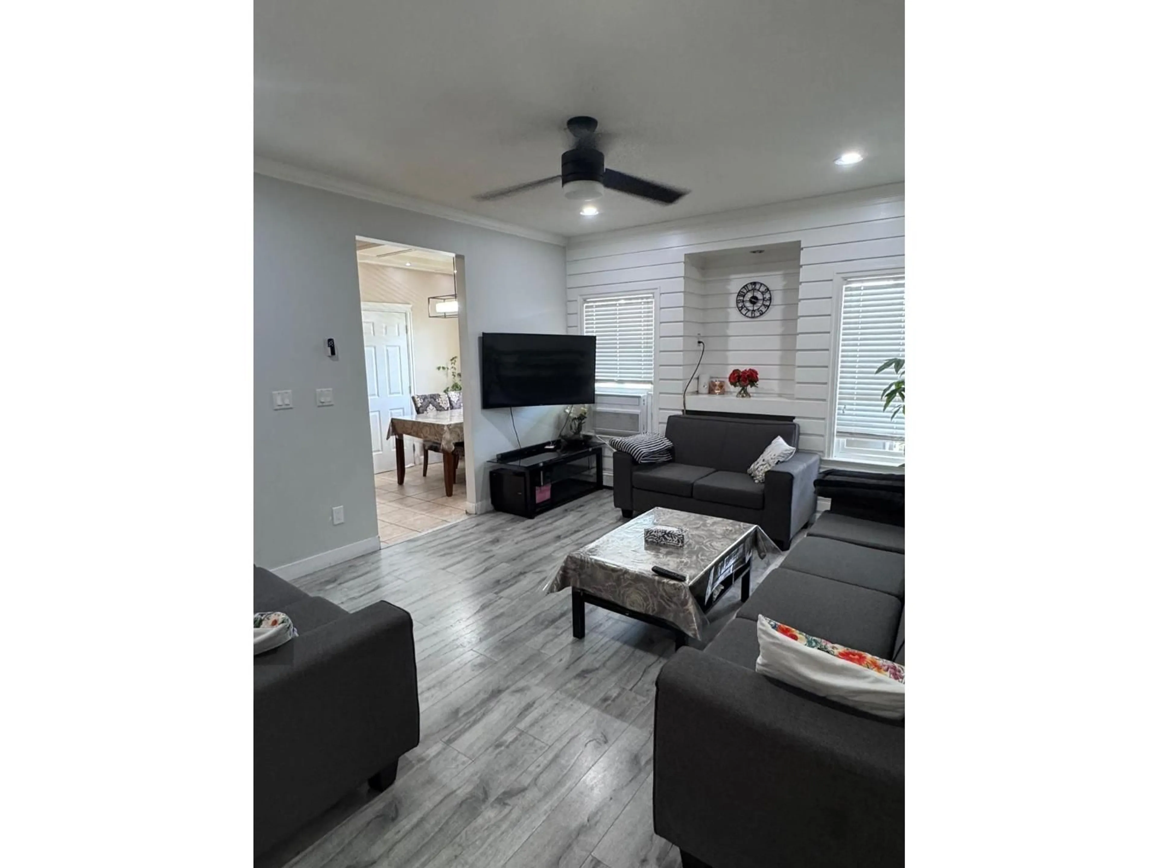 Living room with furniture, wood/laminate floor for 14616 67A AVENUE, Surrey British Columbia V3S0Z4