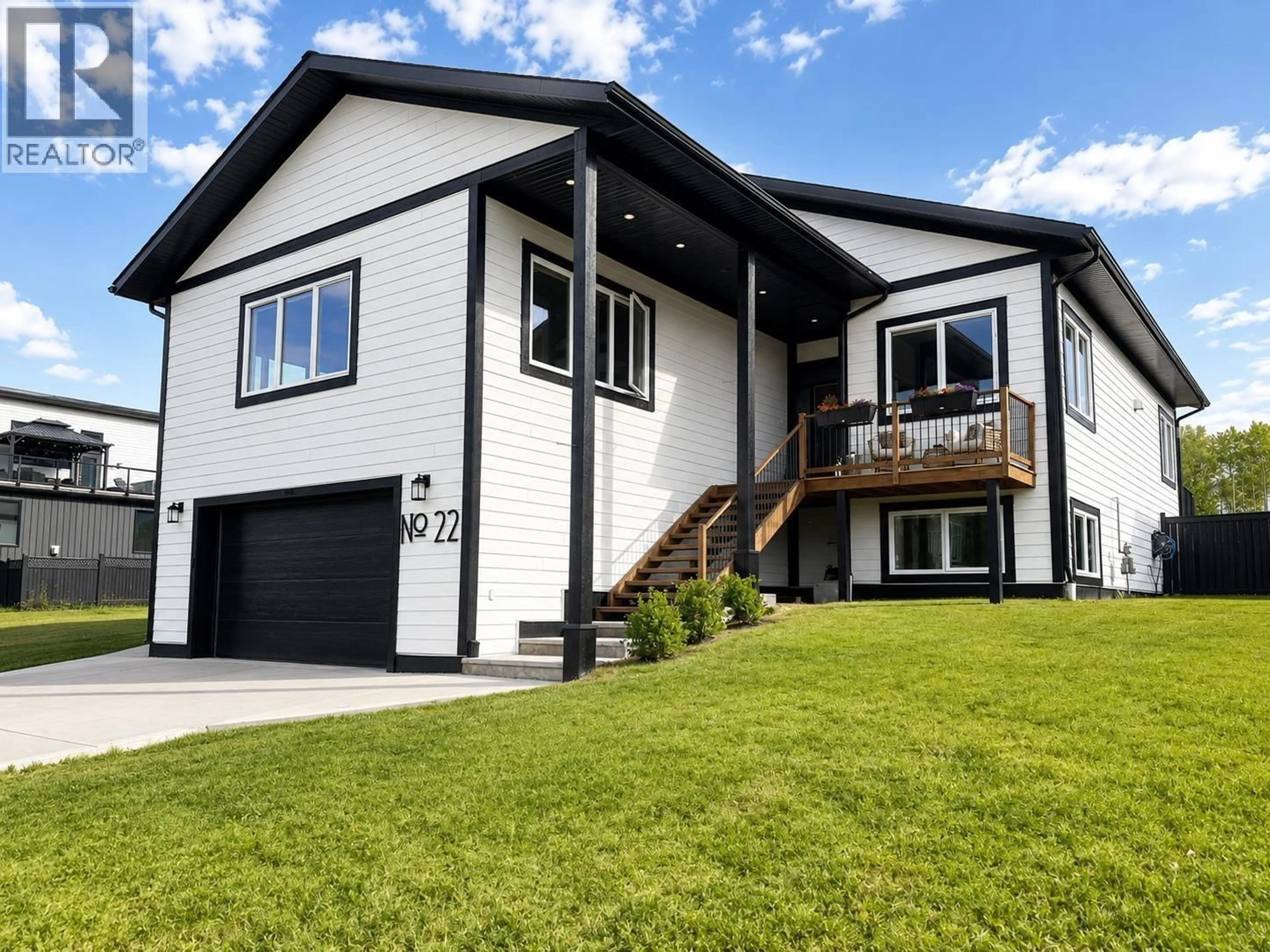 Home with vinyl exterior material, street for 22 STARLITER WAY, Smithers British Columbia V0J2N2