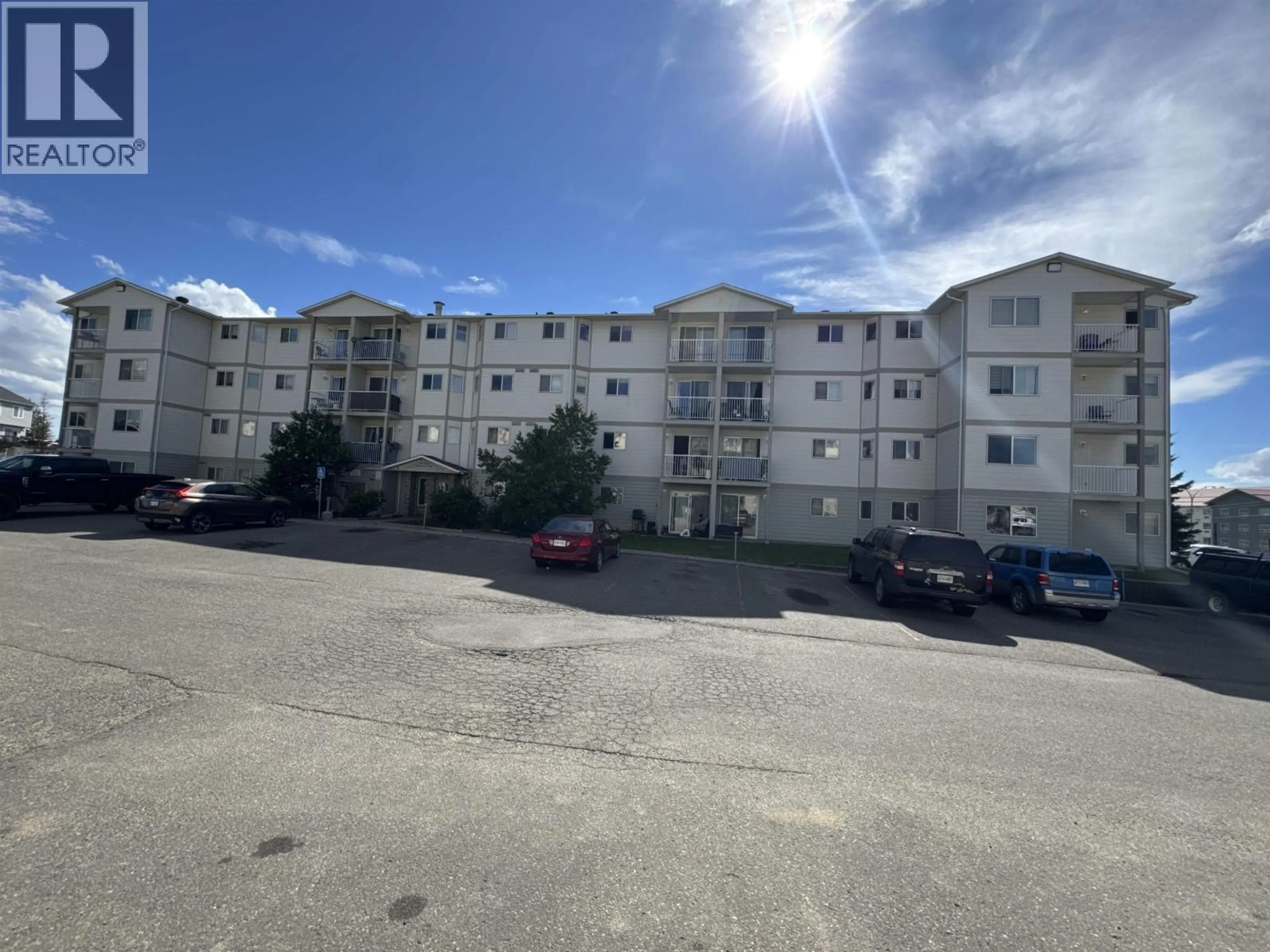 A pic from outside/outdoor area/front of a property/back of a property/a pic from drone, unknown for 406 - 8507 86 STREET, Fort St. John British Columbia V1J0E4