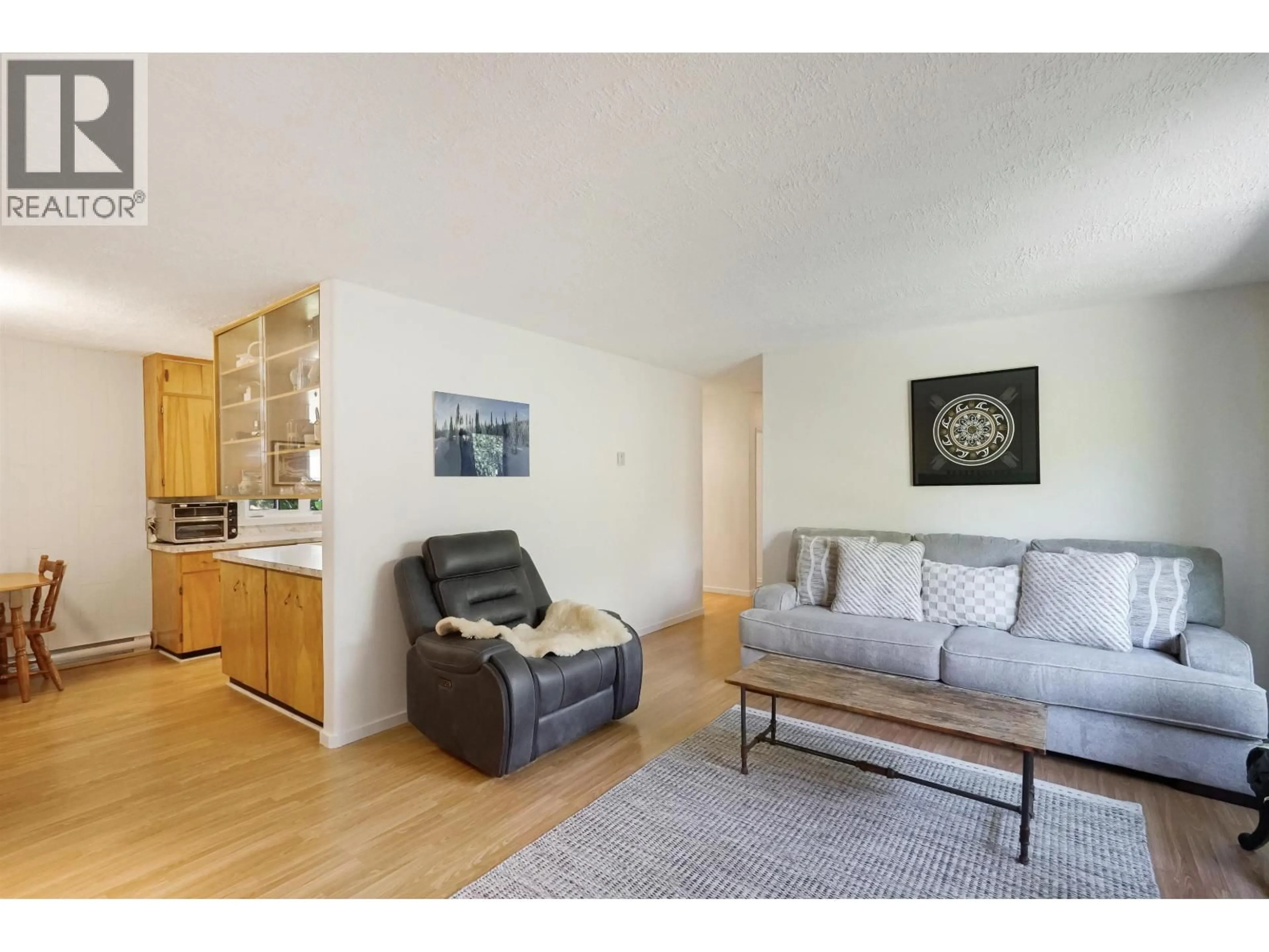 Living room with furniture, wood/laminate floor for 90 KECHIKA STREET, Kitimat British Columbia V8C1Y8