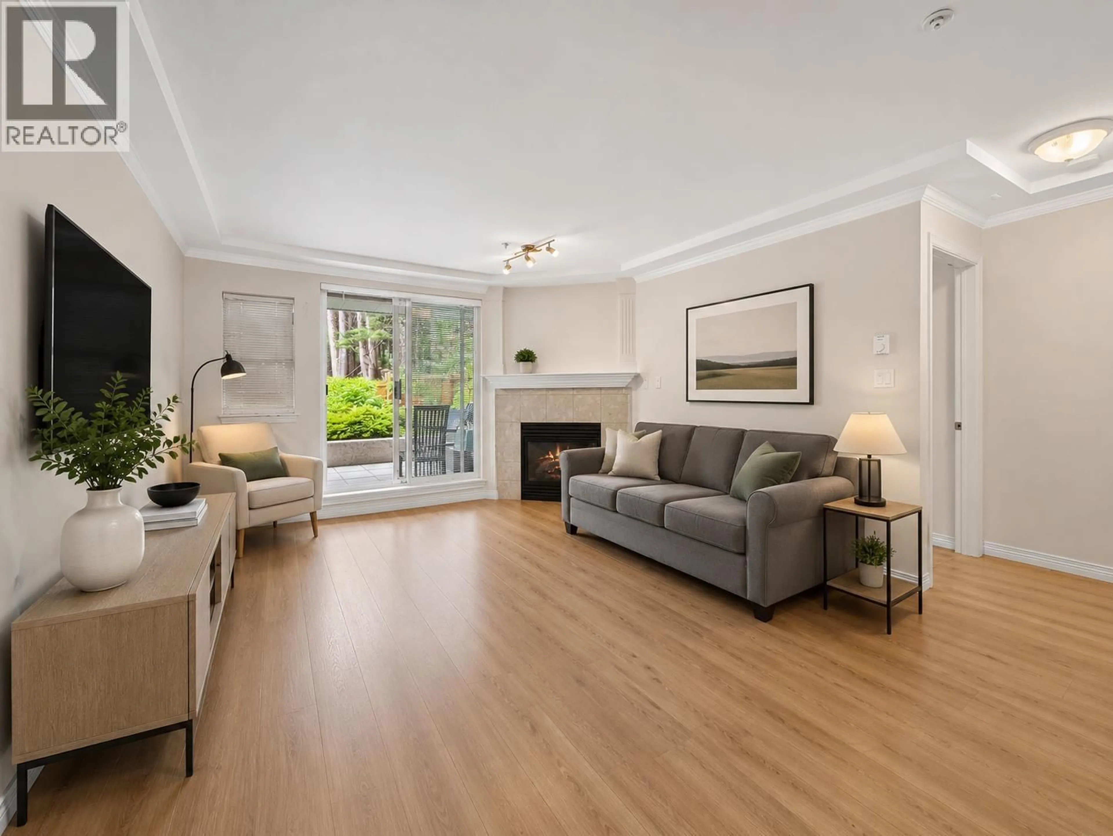 Living room with furniture, wood/laminate floor for 104 - 1281 PARKGATE AVENUE, North Vancouver British Columbia V7H3A3