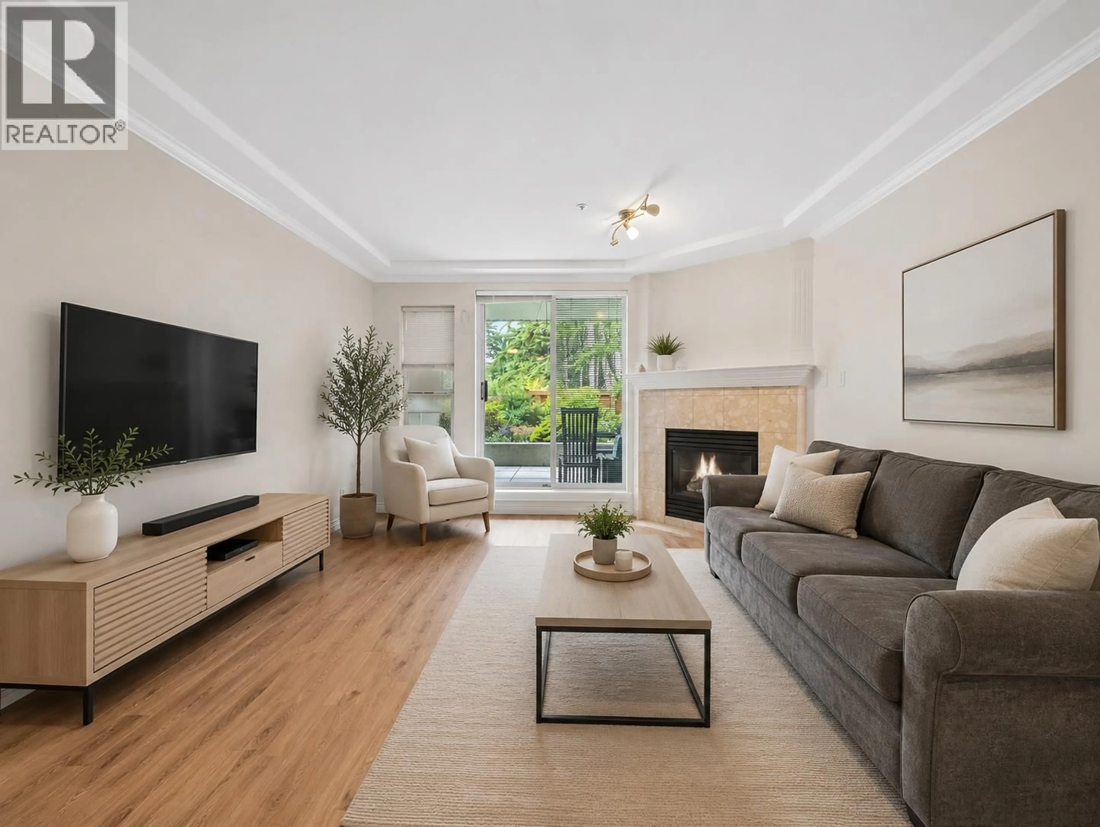 Living room with furniture, wood/laminate floor for 104 - 1281 PARKGATE AVENUE, North Vancouver British Columbia V7H3A3