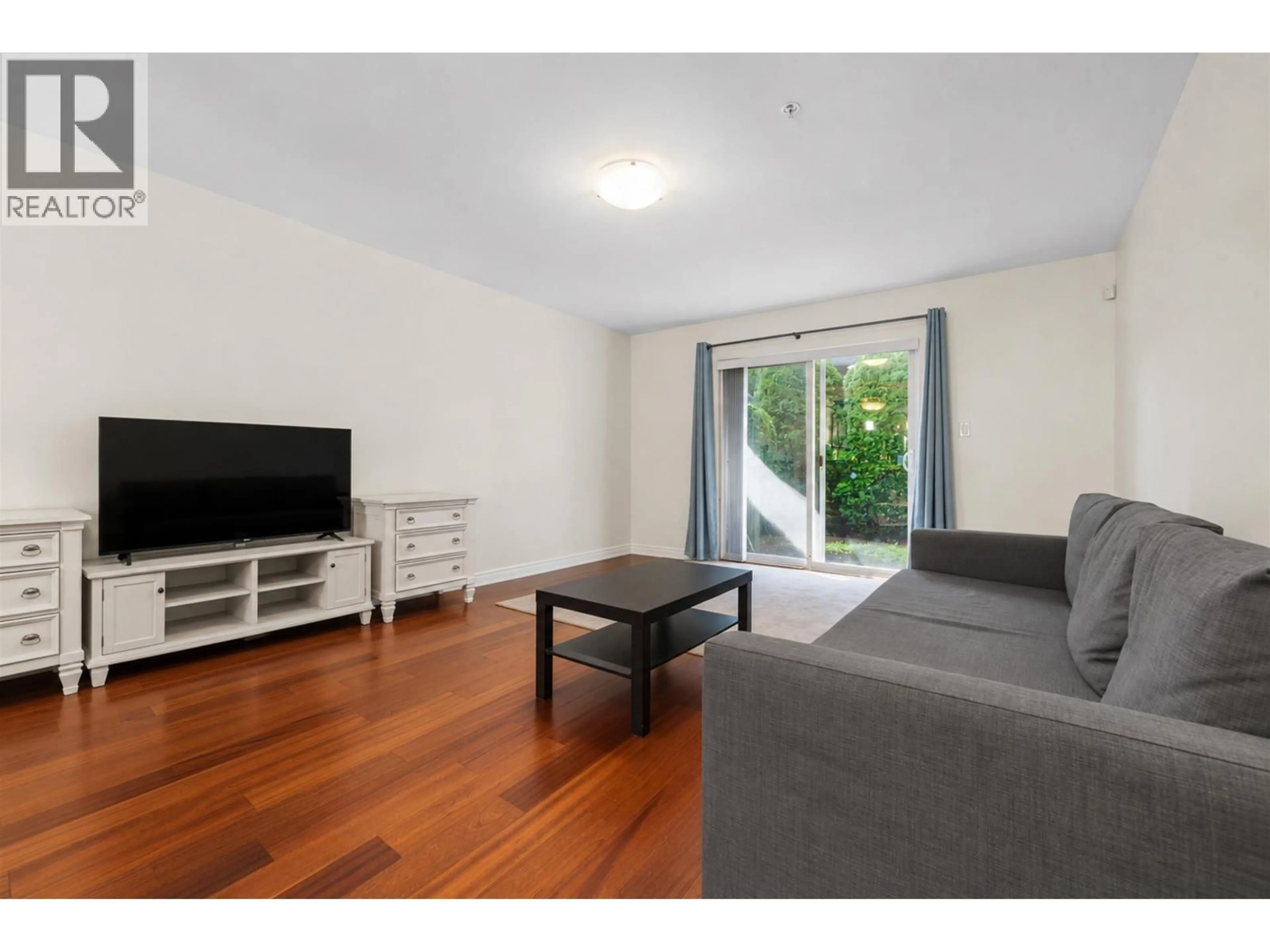 Living room with furniture, wood/laminate floor for 7 - 6498 ELGIN AVENUE, Burnaby British Columbia V5H3S6