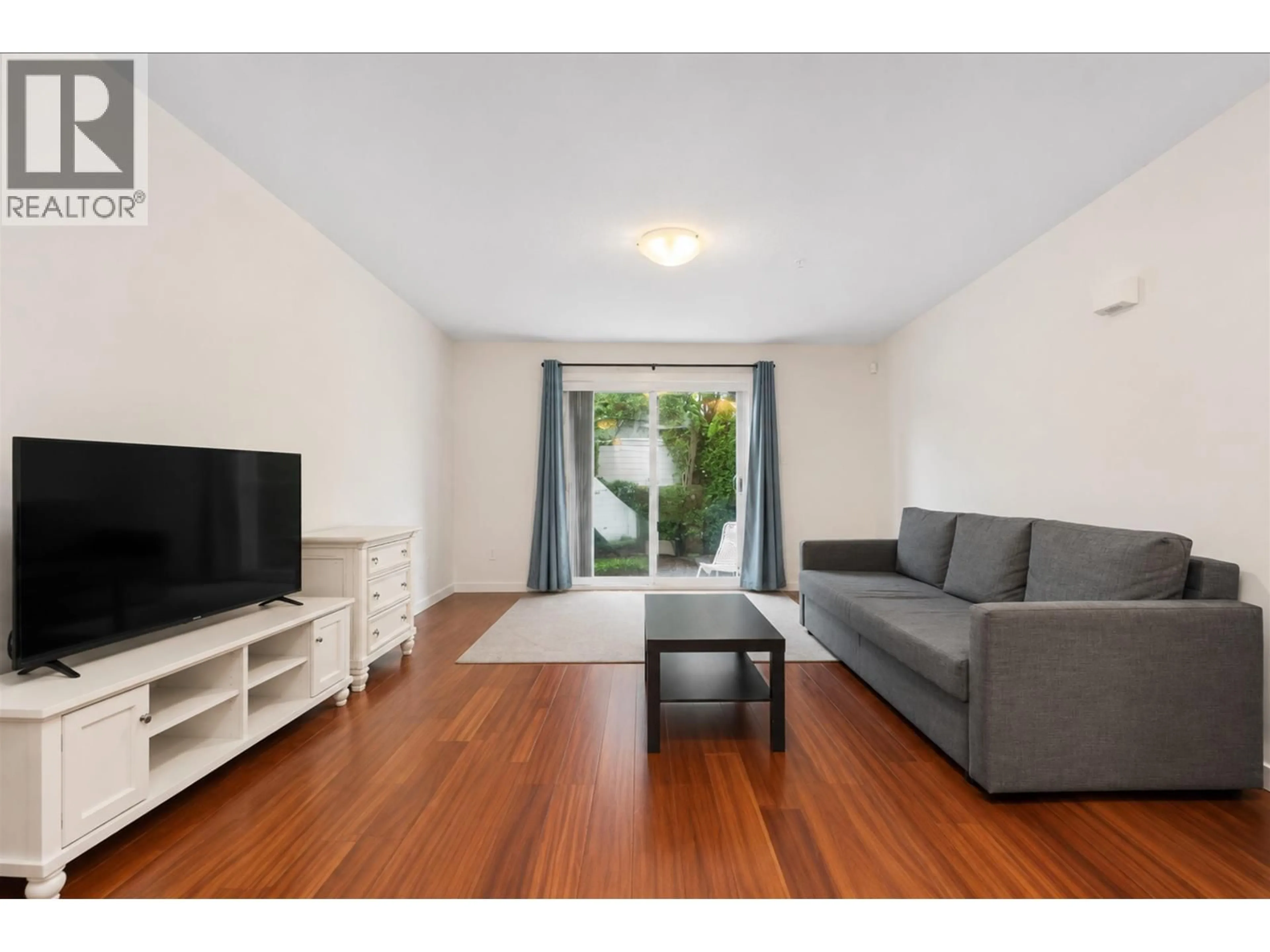 Living room with furniture, wood/laminate floor for 7 - 6498 ELGIN AVENUE, Burnaby British Columbia V5H3S6