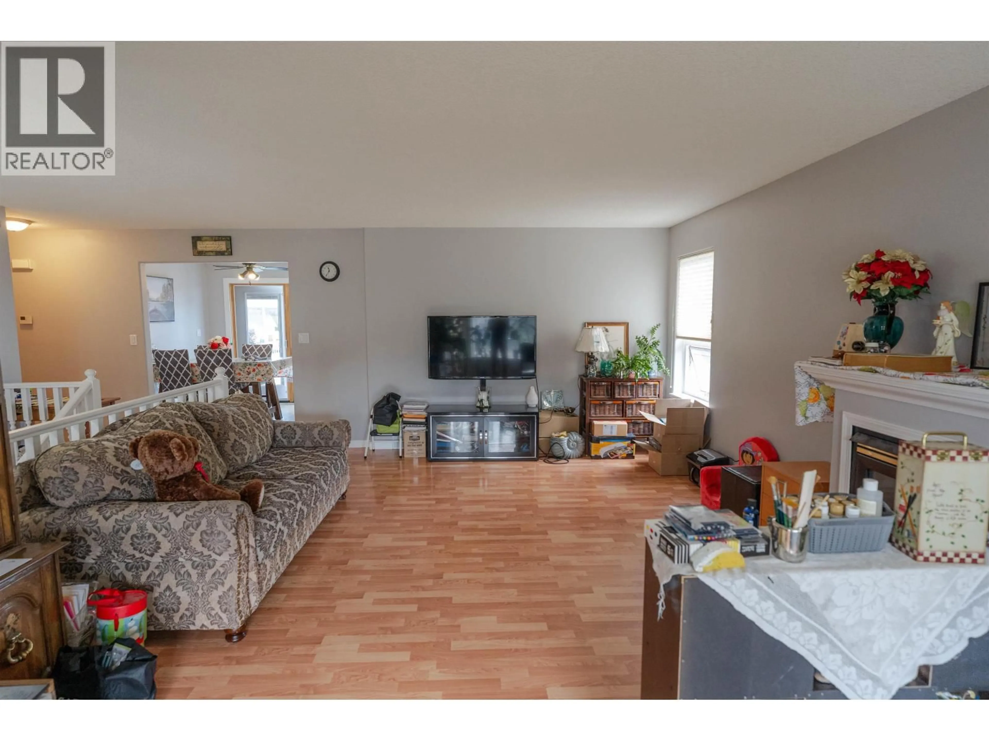 Living room with furniture, unknown for 8720 117 AVENUE, Fort St. John British Columbia V1J6W6