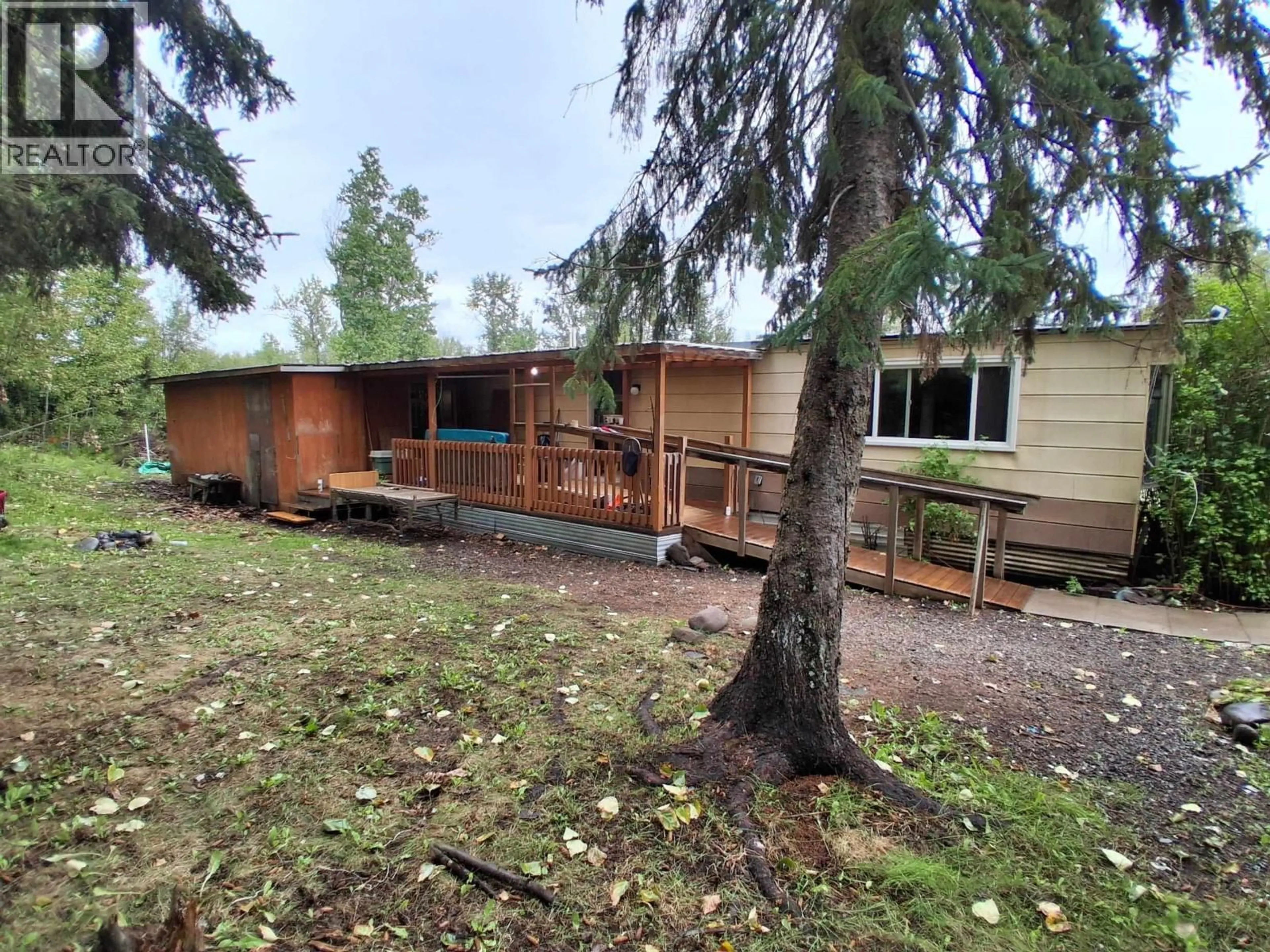 A pic from outside/outdoor area/front of a property/back of a property/a pic from drone, forest/trees view for 17 - 2123 RIVERSIDE DRIVE, Smithers British Columbia V0J2N0