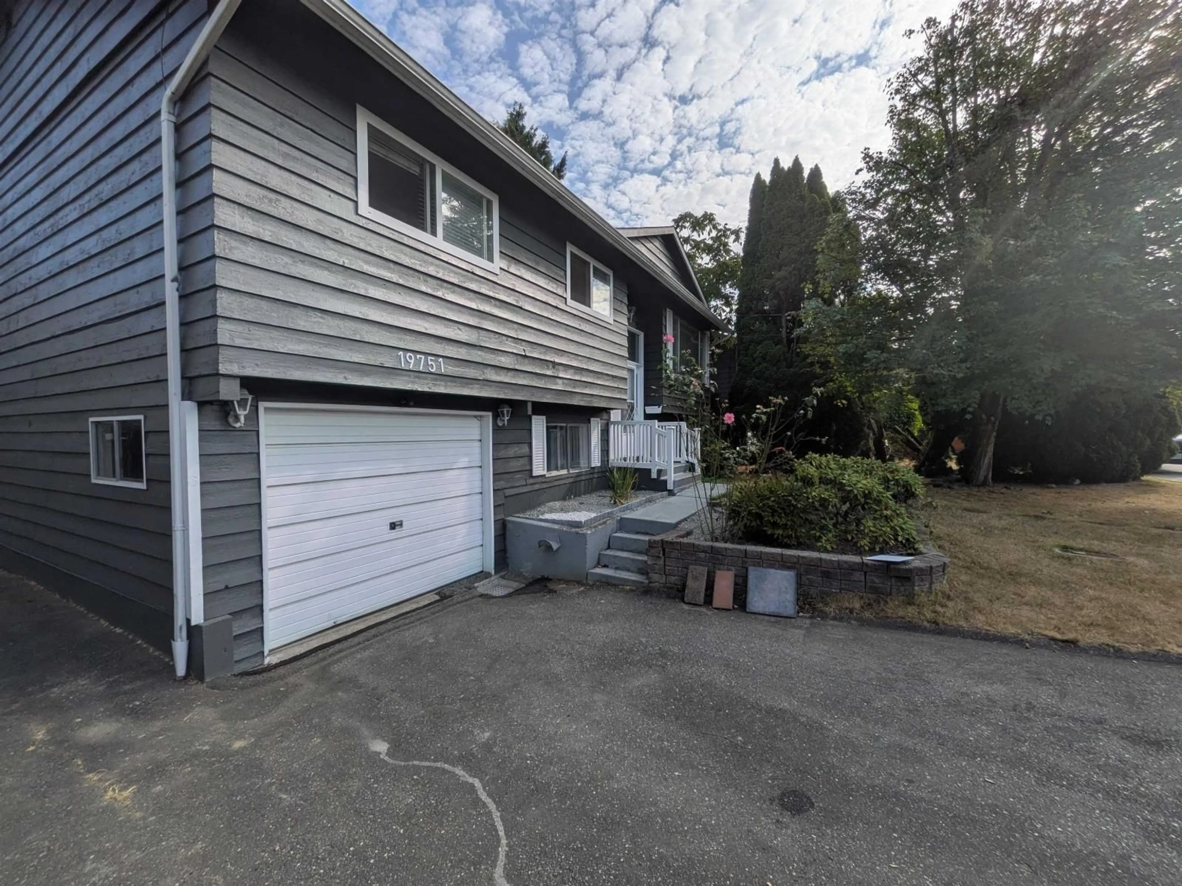 A pic from outside/outdoor area/front of a property/back of a property/a pic from drone, street for 19751 54A AVENUE, Langley British Columbia V3A3W4