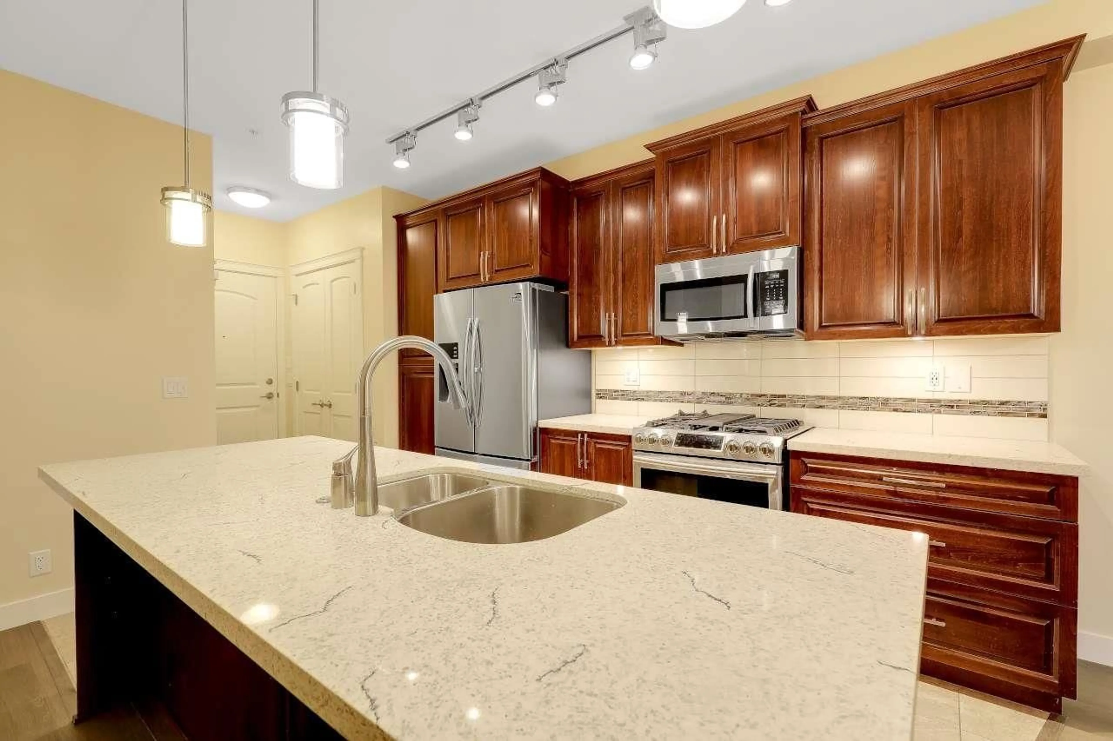 Open concept kitchen, ceramic/tile floor for A303 - 20716 WILLOUGHBY TOWN CENTRE DRIVE, Langley British Columbia V2Y3J7
