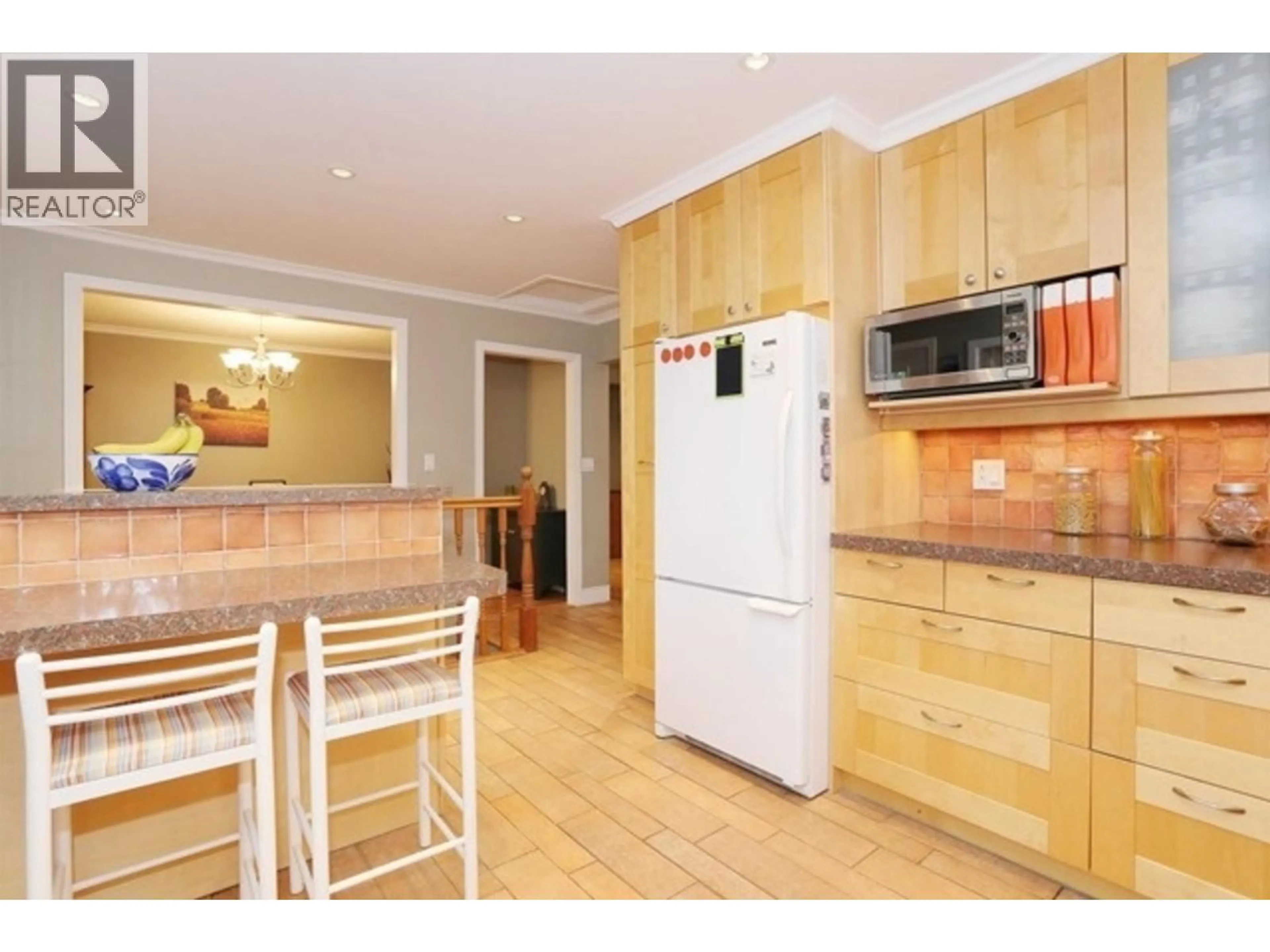 Open concept kitchen, wood/laminate floor for 5214 12 AVENUE, Delta British Columbia V4M2A8