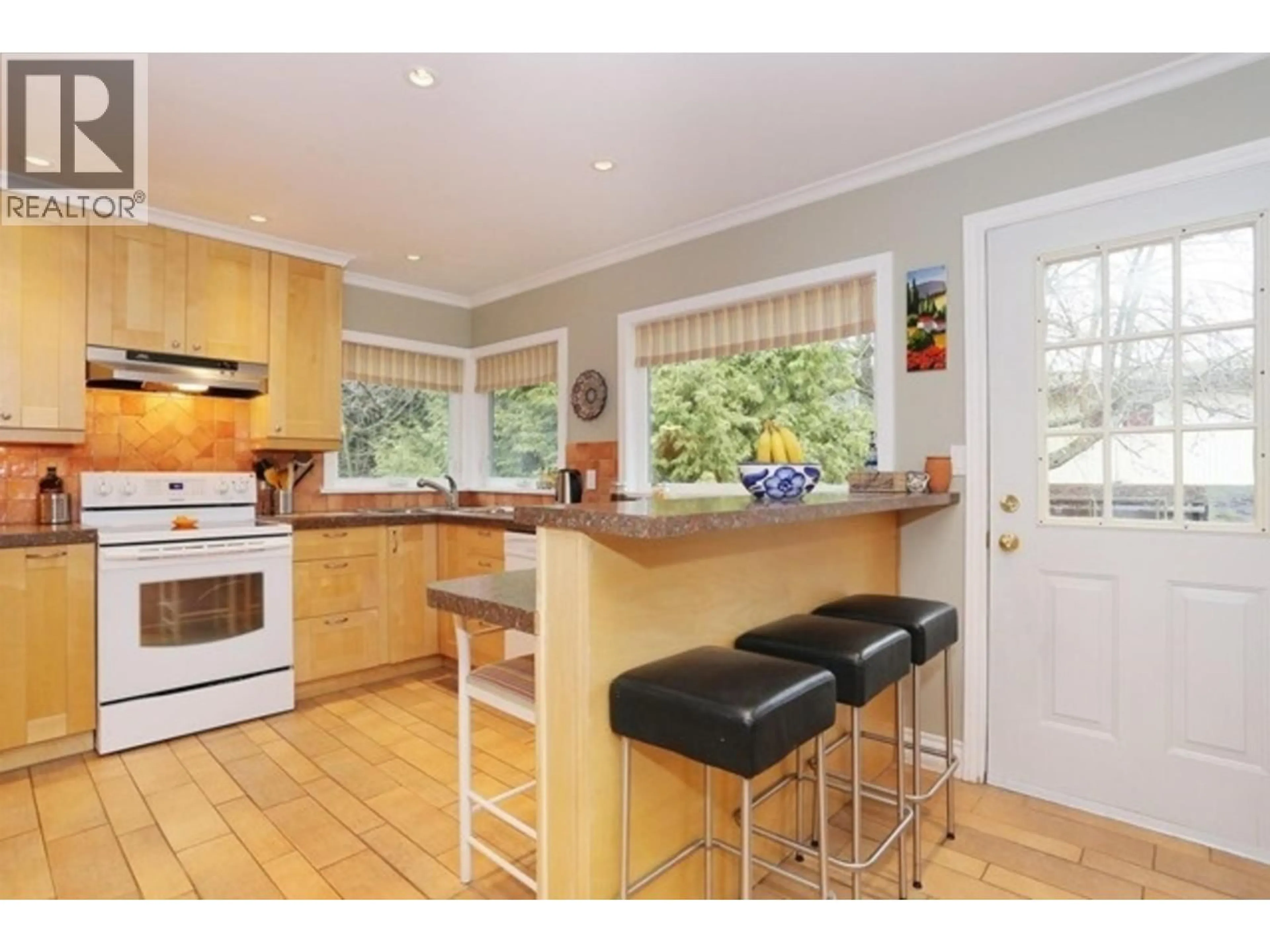 Open concept kitchen, wood/laminate floor for 5214 12 AVENUE, Delta British Columbia V4M2A8