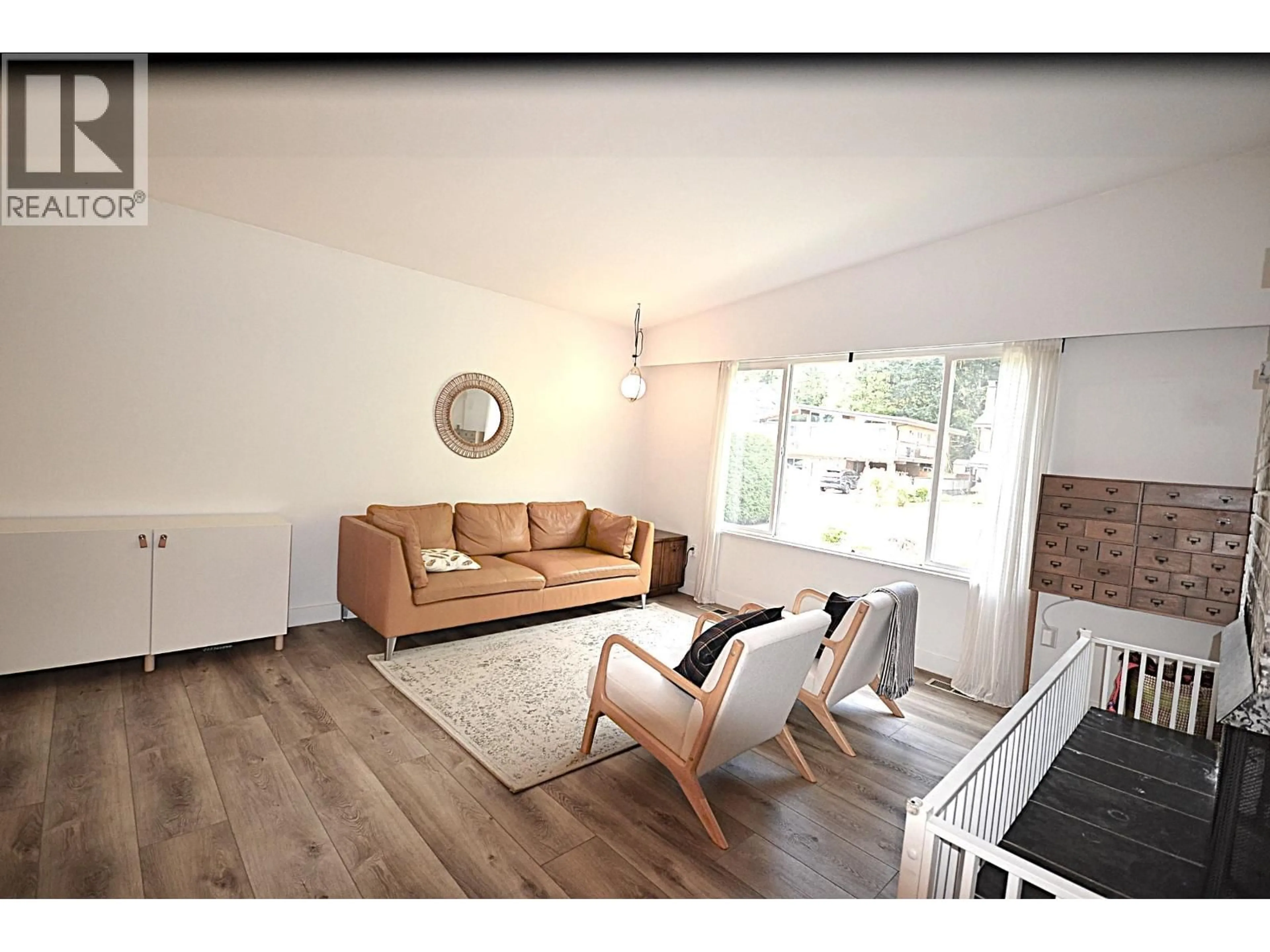 Living room with furniture, wood/laminate floor for 2280 KING ALBERT AVENUE, Coquitlam British Columbia V3J1Z5