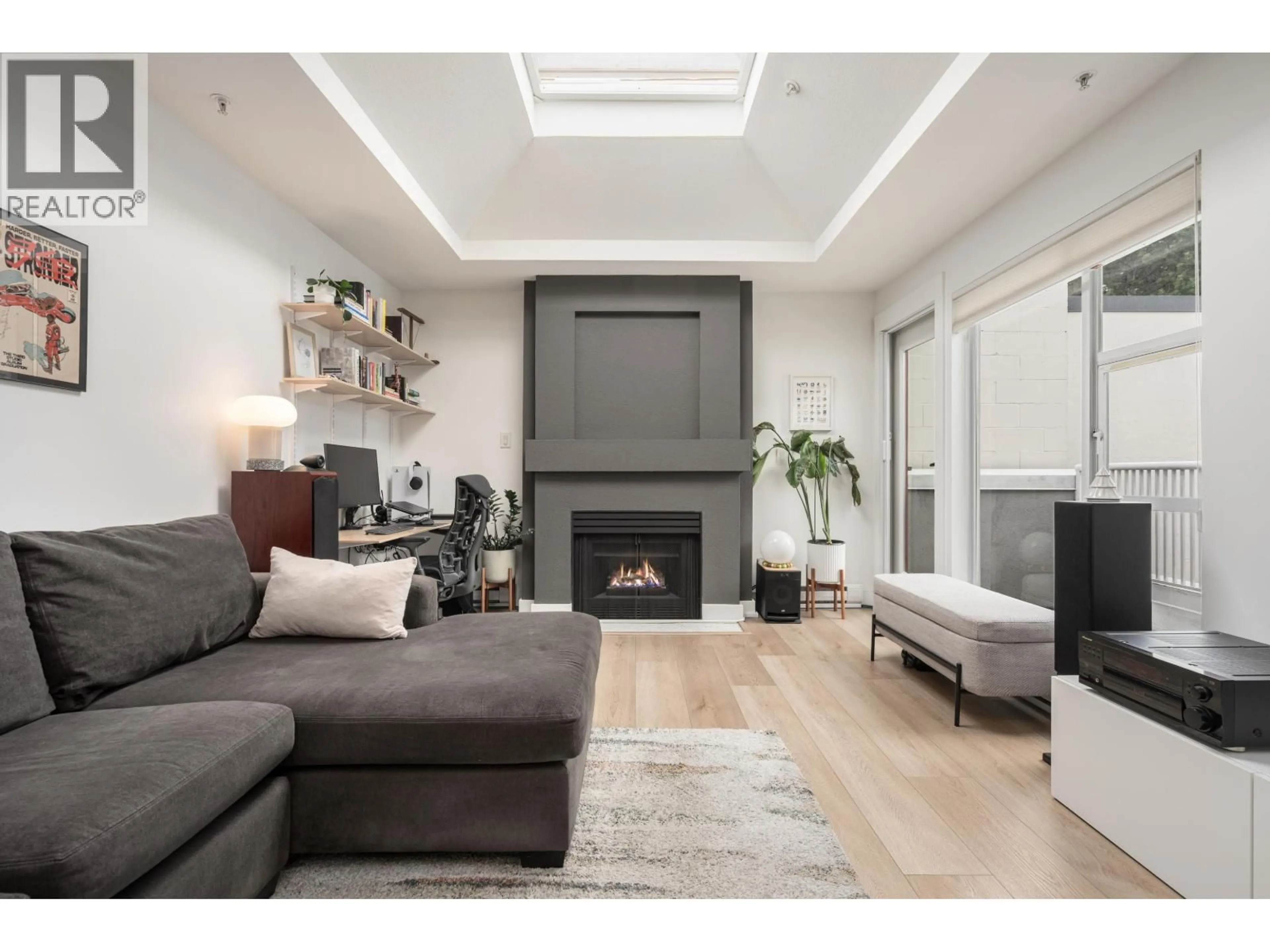 Living room with furniture, wood/laminate floor for 407 - 1333 7TH AVENUE, Vancouver British Columbia V6H1B8