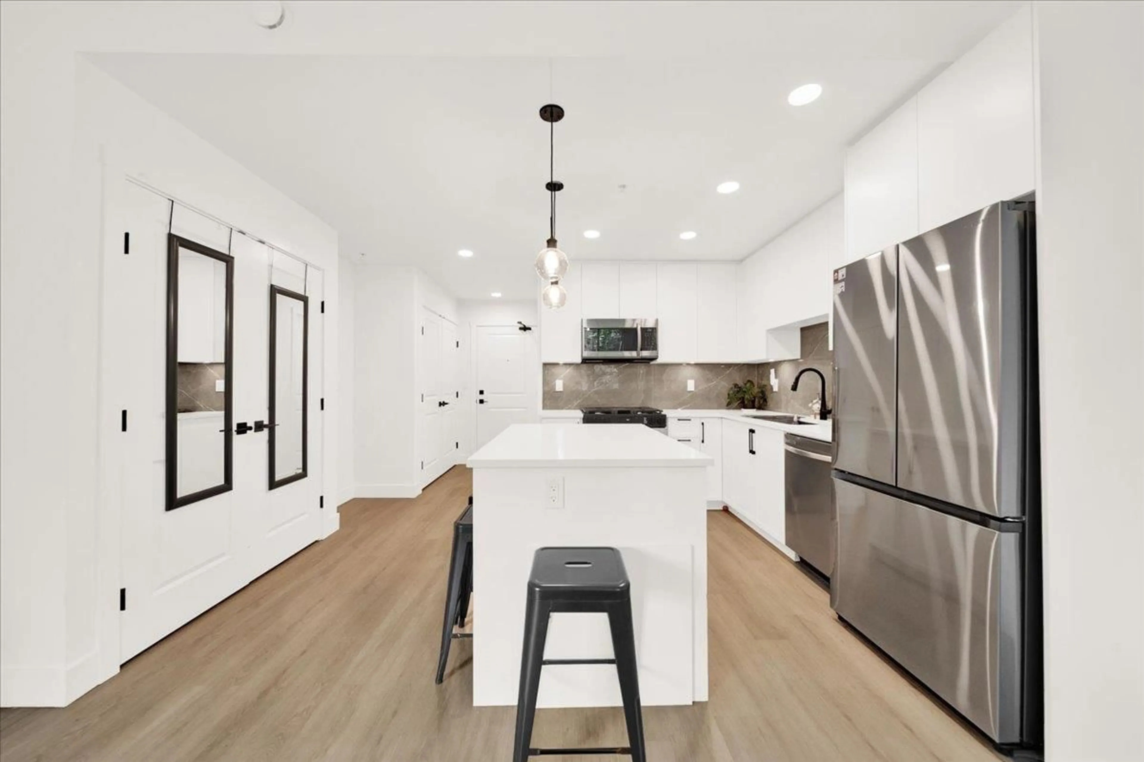 Open concept kitchen, unknown for 309 - 3528 146A STREET, Surrey British Columbia V4P0H4
