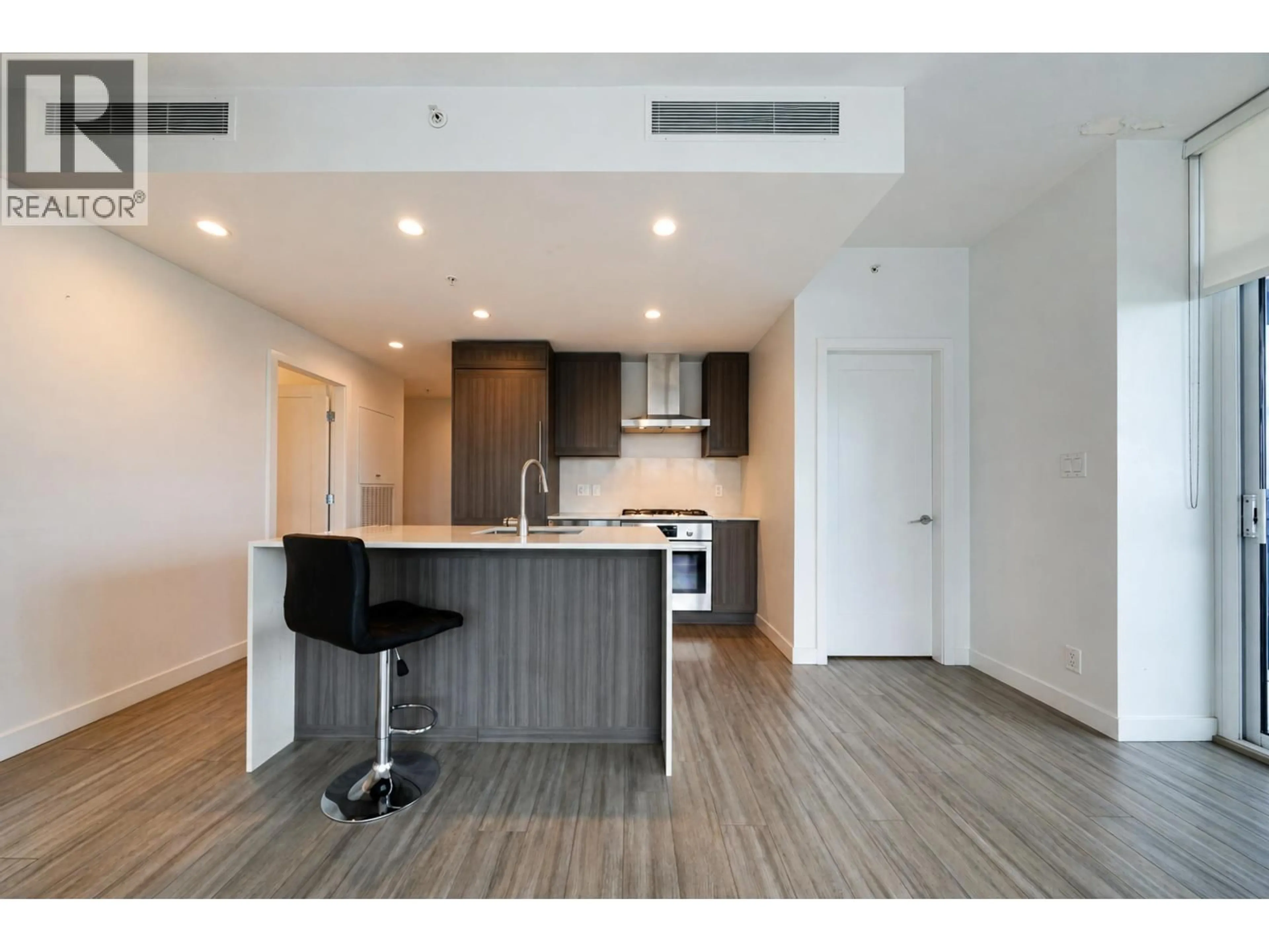 Open concept kitchen, wood/laminate floor for 2004 - 2311 BETA AVENUE, Burnaby British Columbia V5C0M1
