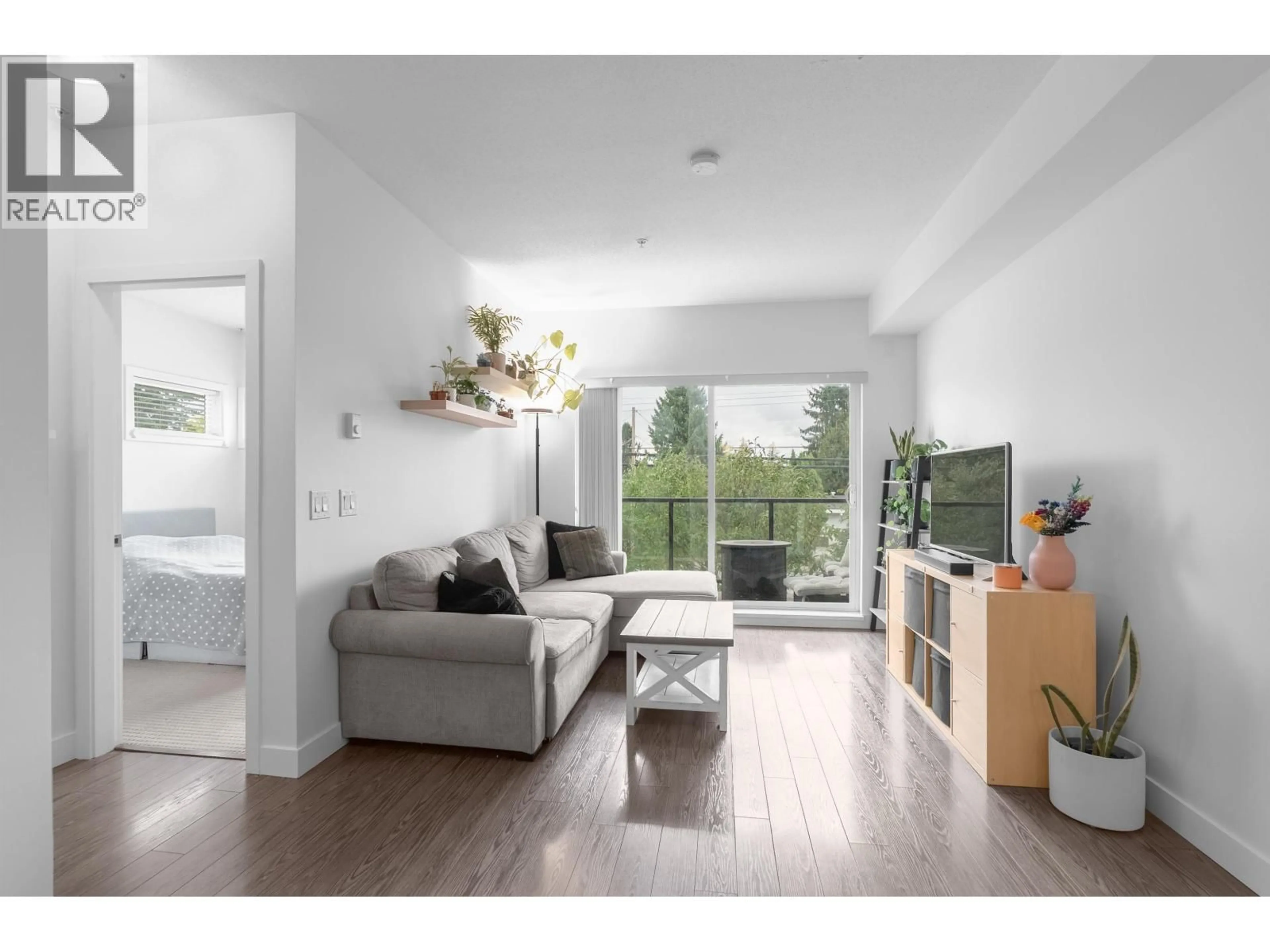 Living room with furniture, wood/laminate floor for 207 - 12070 227 STREET, Maple Ridge British Columbia V2X6J5