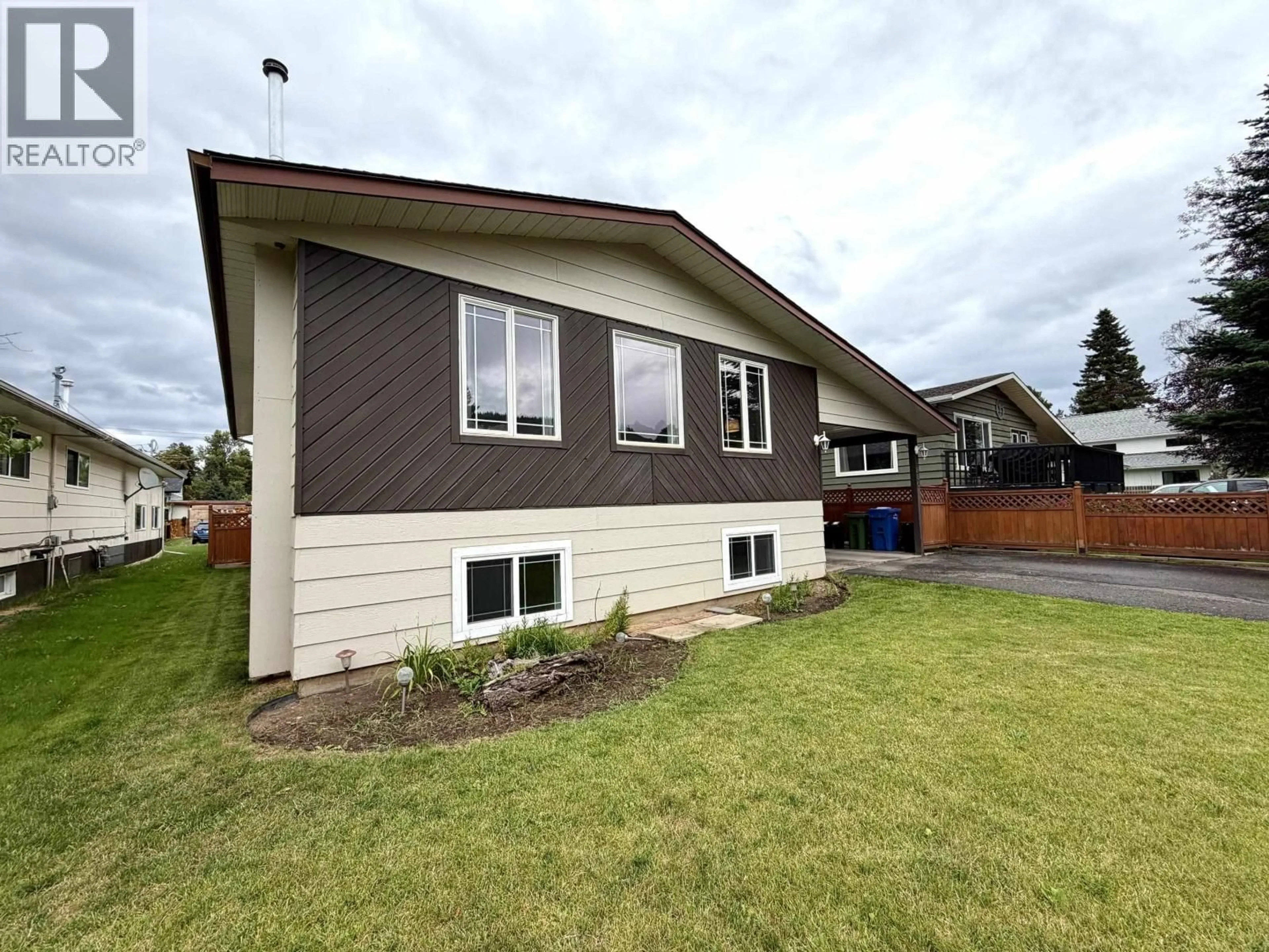 Home with vinyl exterior material, street for 4280 FIRST AVENUE, Smithers British Columbia V0J2N0