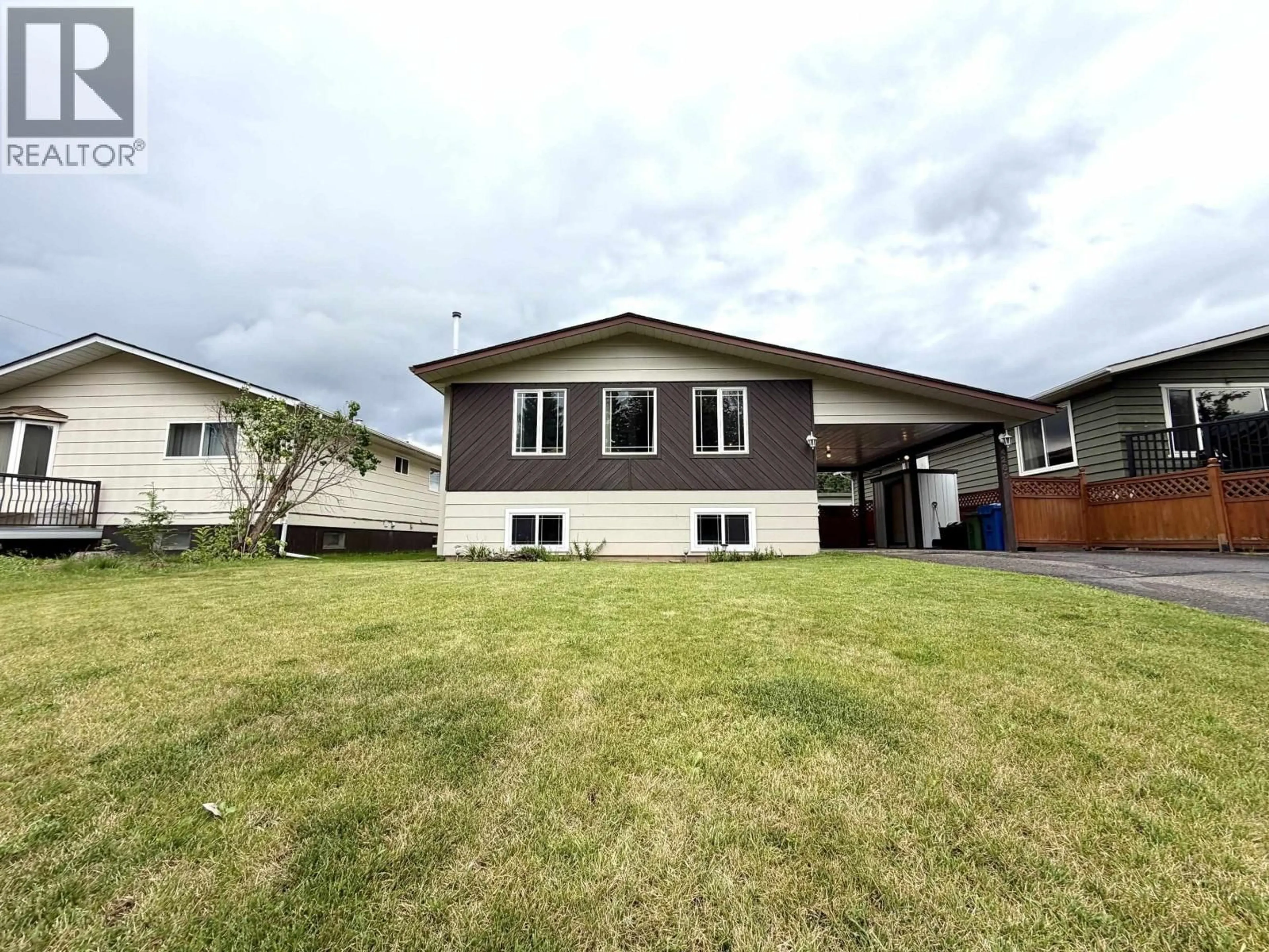 Home with vinyl exterior material, street for 4280 FIRST AVENUE, Smithers British Columbia V0J2N0