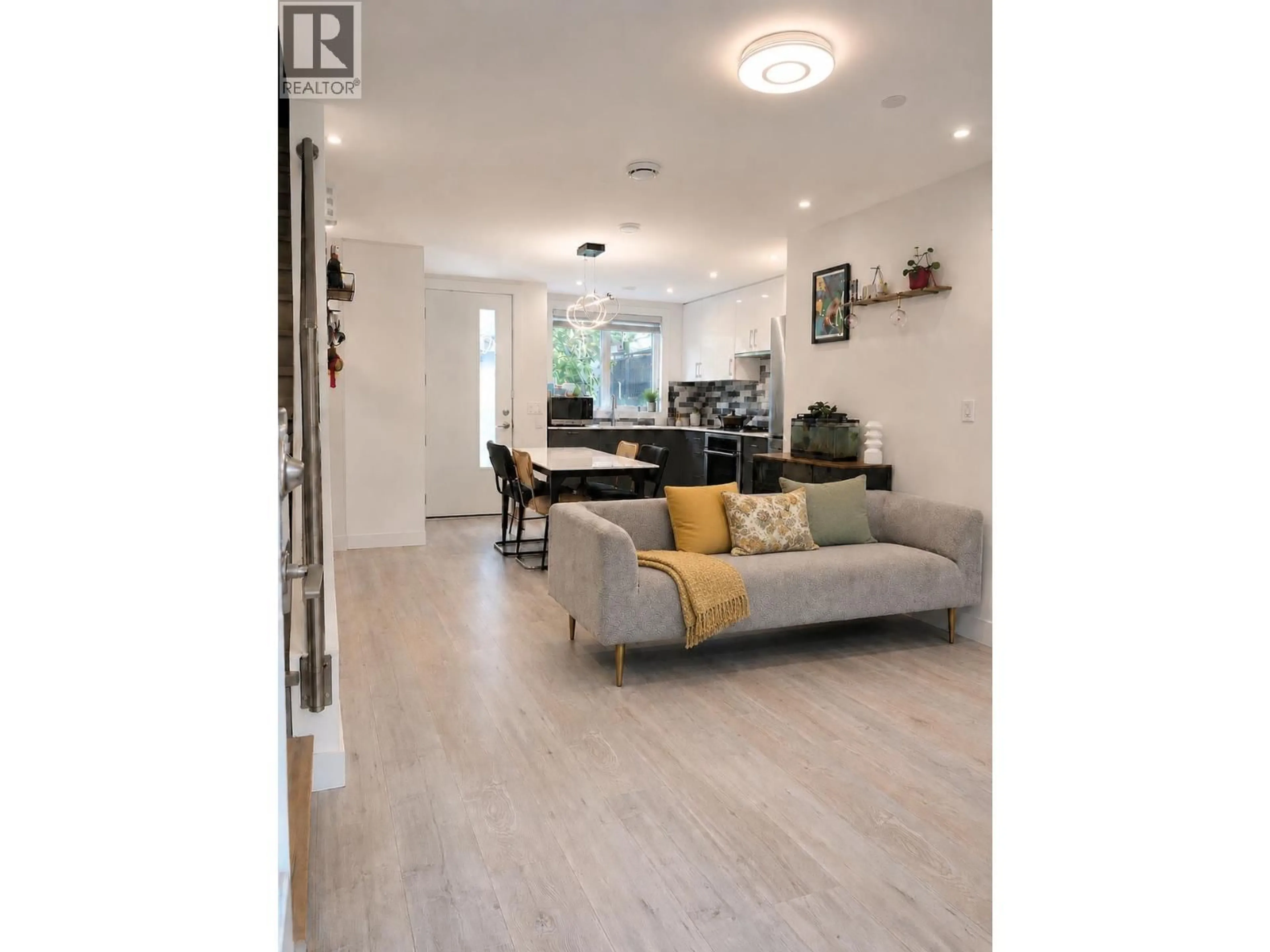 Living room with furniture, wood/laminate floor for 7887 FRENCH STREET, Vancouver British Columbia V6P4V8