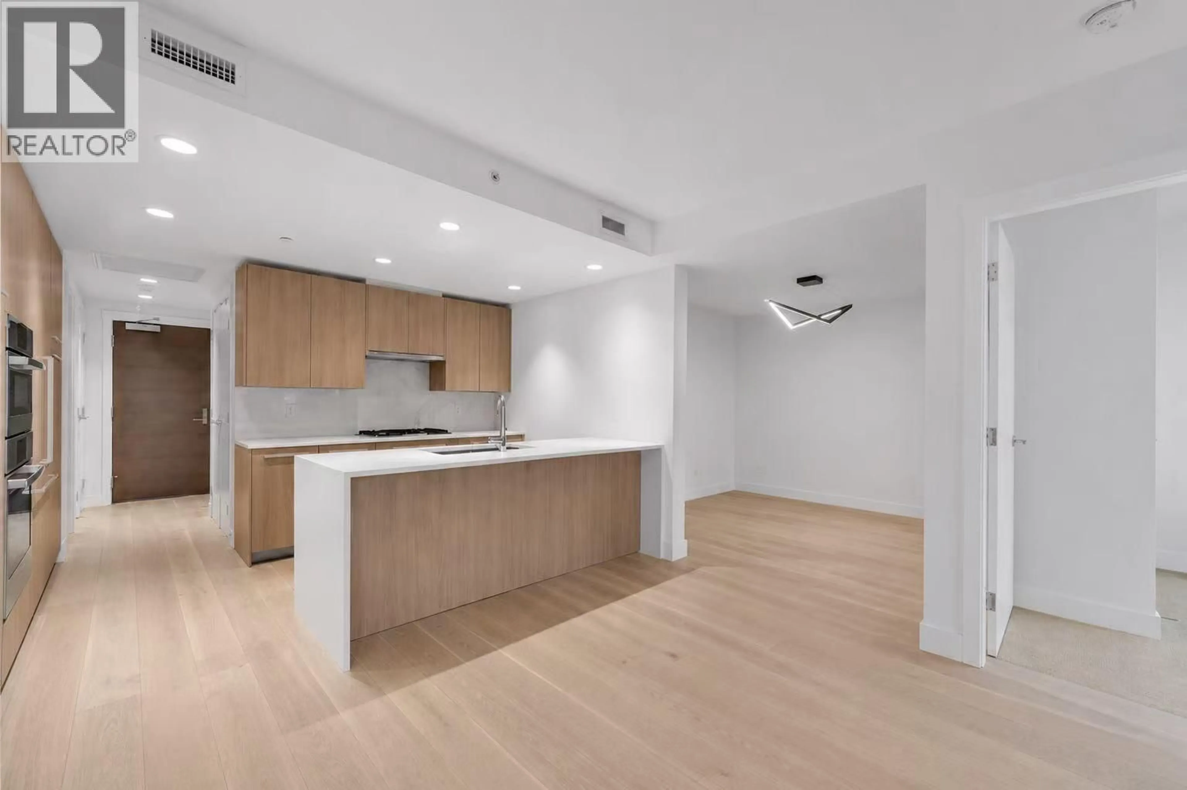 Open concept kitchen, unknown for 405 - 2785 LIBRARY LANE, North Vancouver British Columbia V7J0C3