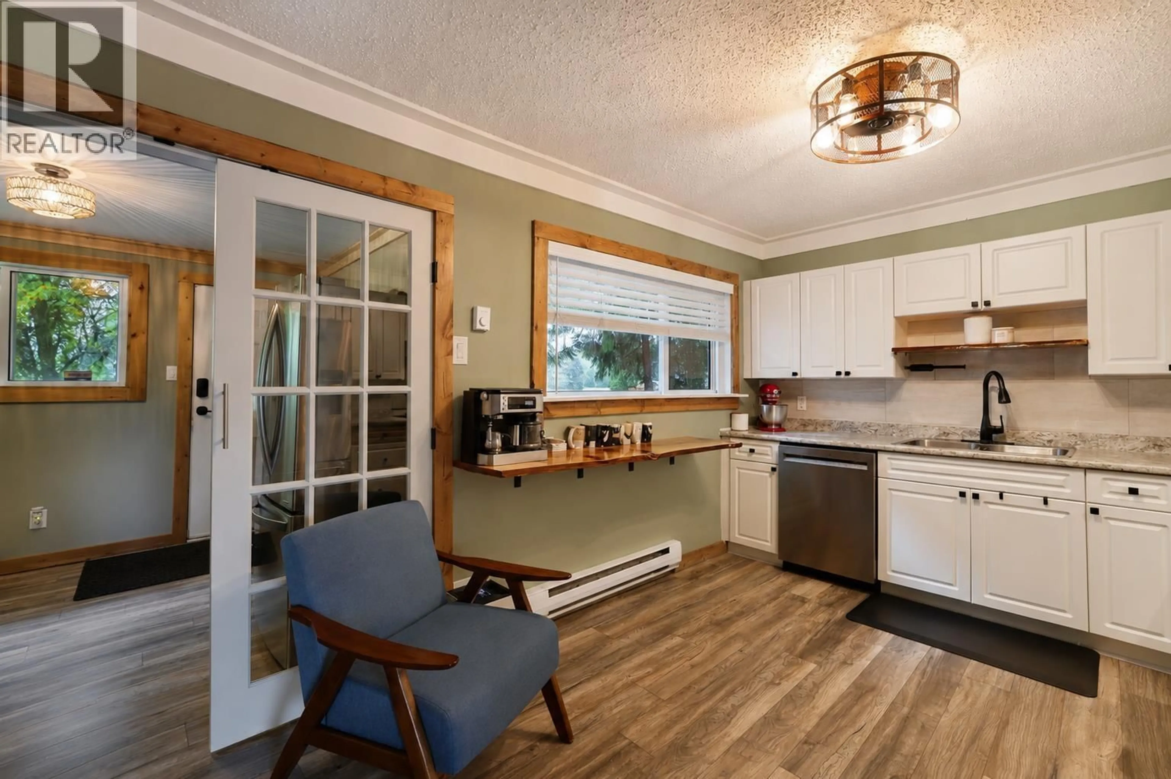 Open concept kitchen, wood/laminate floor for 33 OKANAGAN STREET, Kitimat British Columbia V8C1Z6