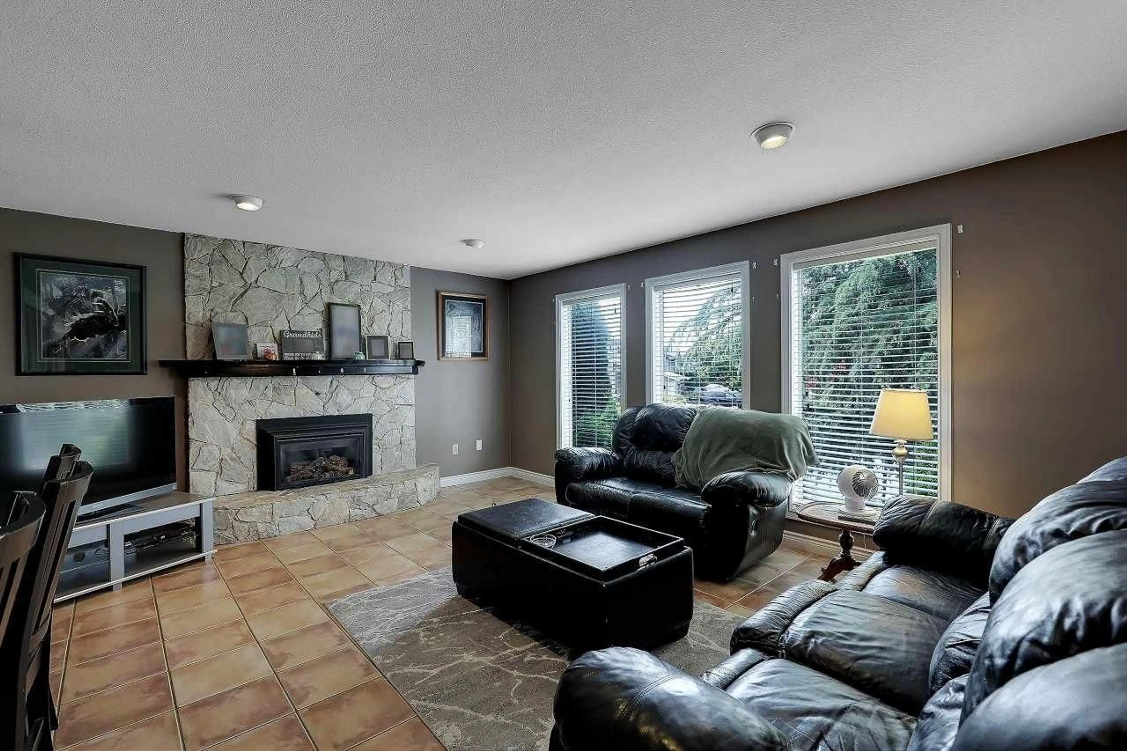 Living room with furniture, ceramic/tile floor for 9230 212B STREET, Langley British Columbia V1M1K9