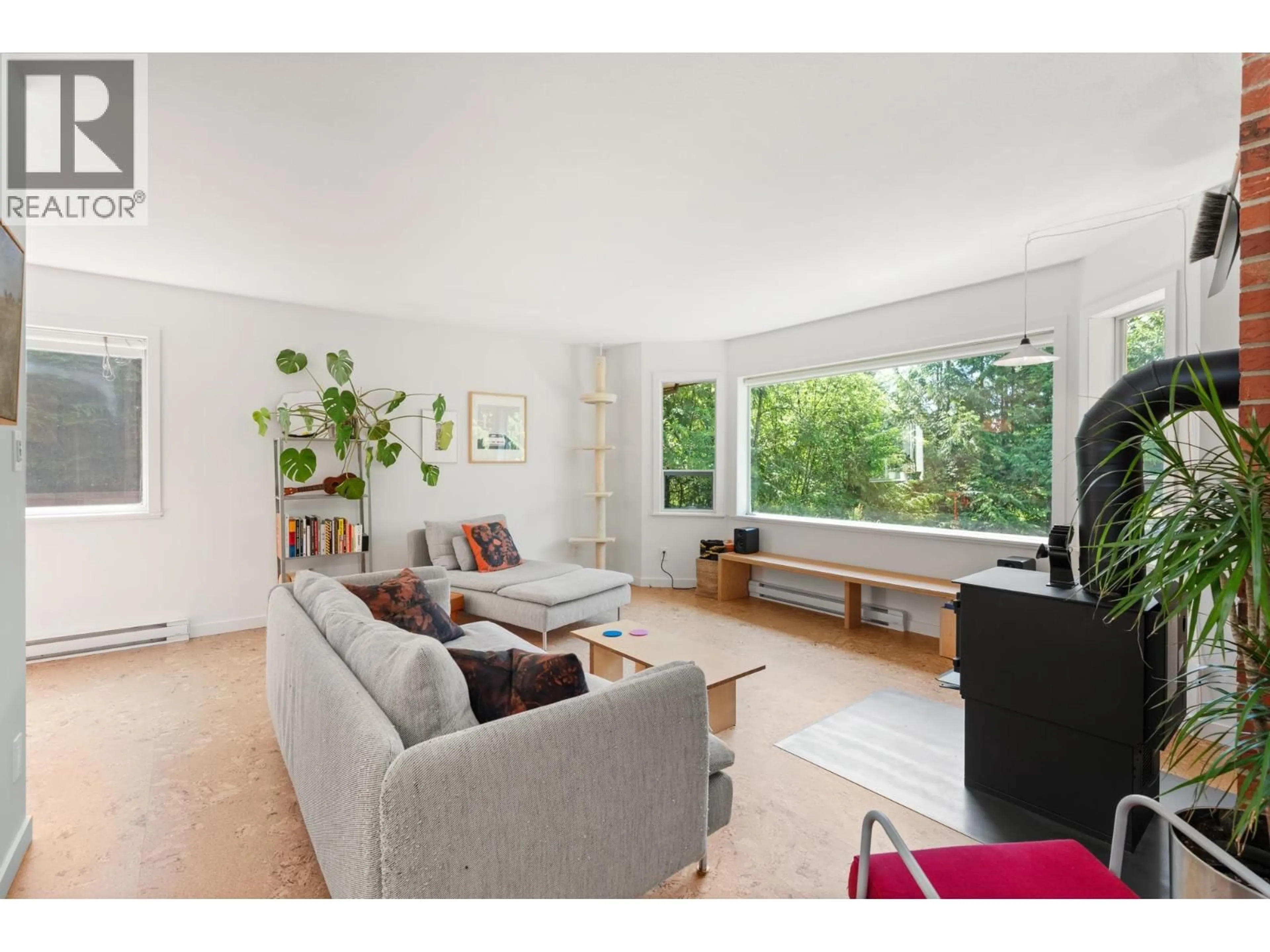 Living room with furniture, wood/laminate floor for 8044 DOGWOOD DRIVE, Halfmoon Bay British Columbia V7Z1A7