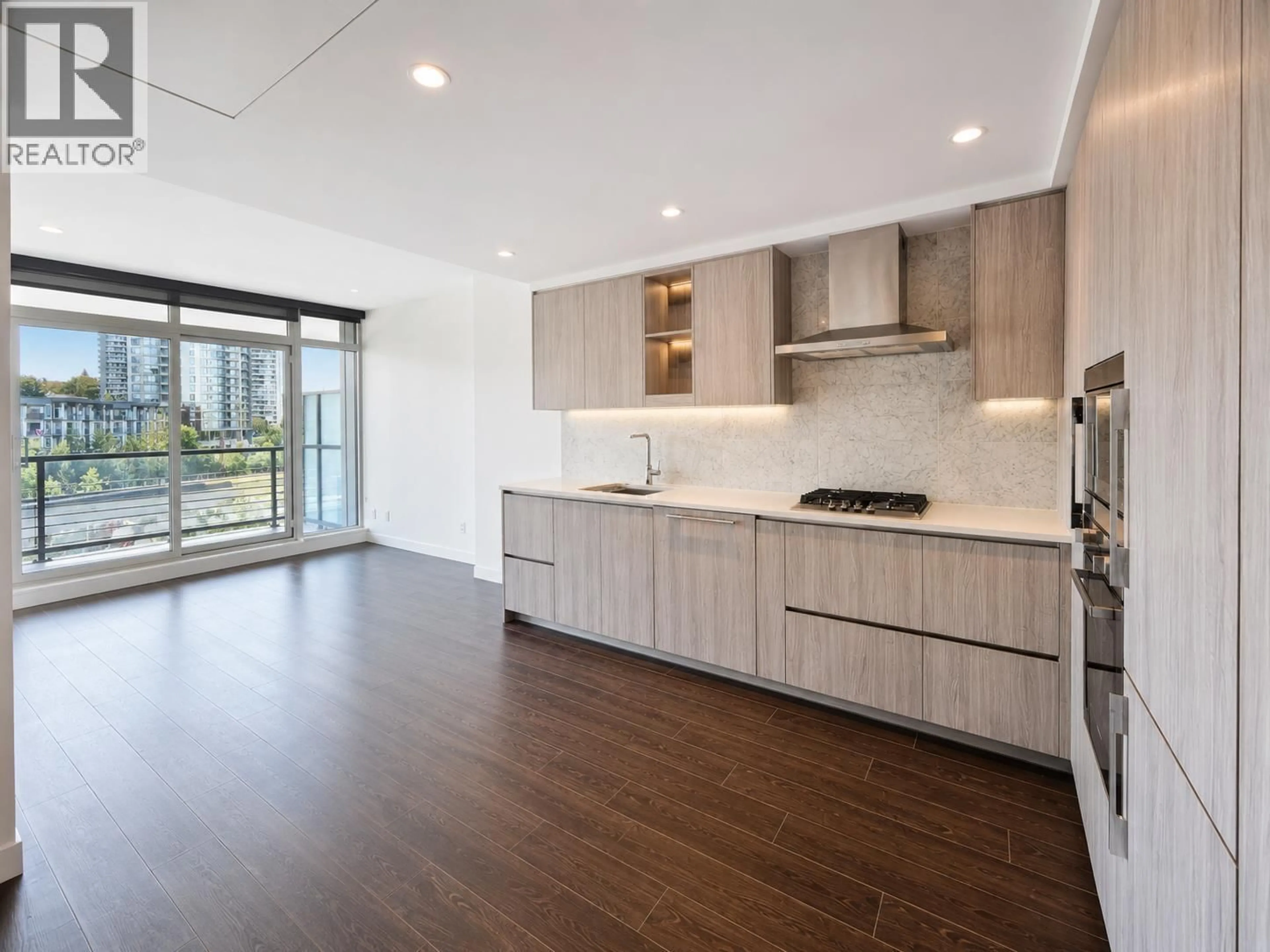 Open concept kitchen, wood/laminate floor for 407 - 4720 LOUGHEED HIGHWAY, Burnaby British Columbia V5C0M8