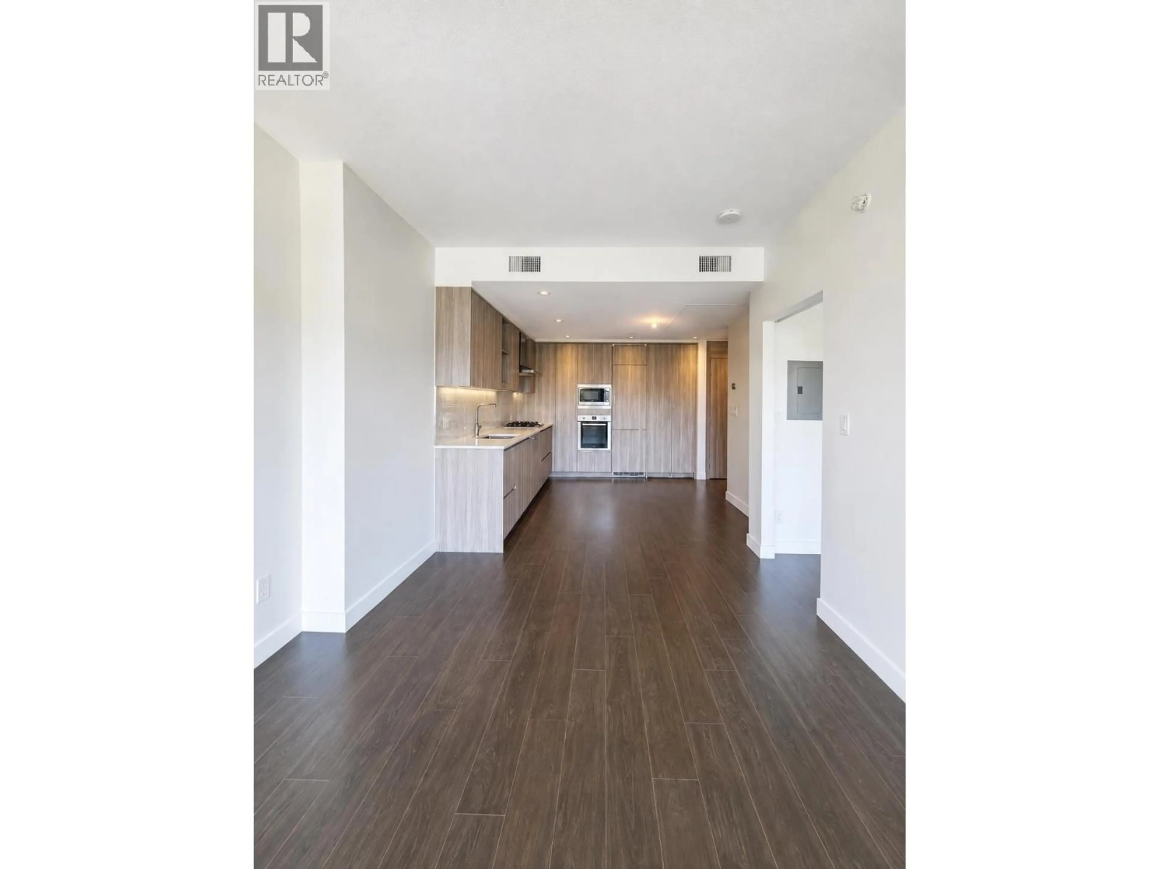 Open concept kitchen, wood/laminate floor for 407 - 4720 LOUGHEED HIGHWAY, Burnaby British Columbia V5C0M8