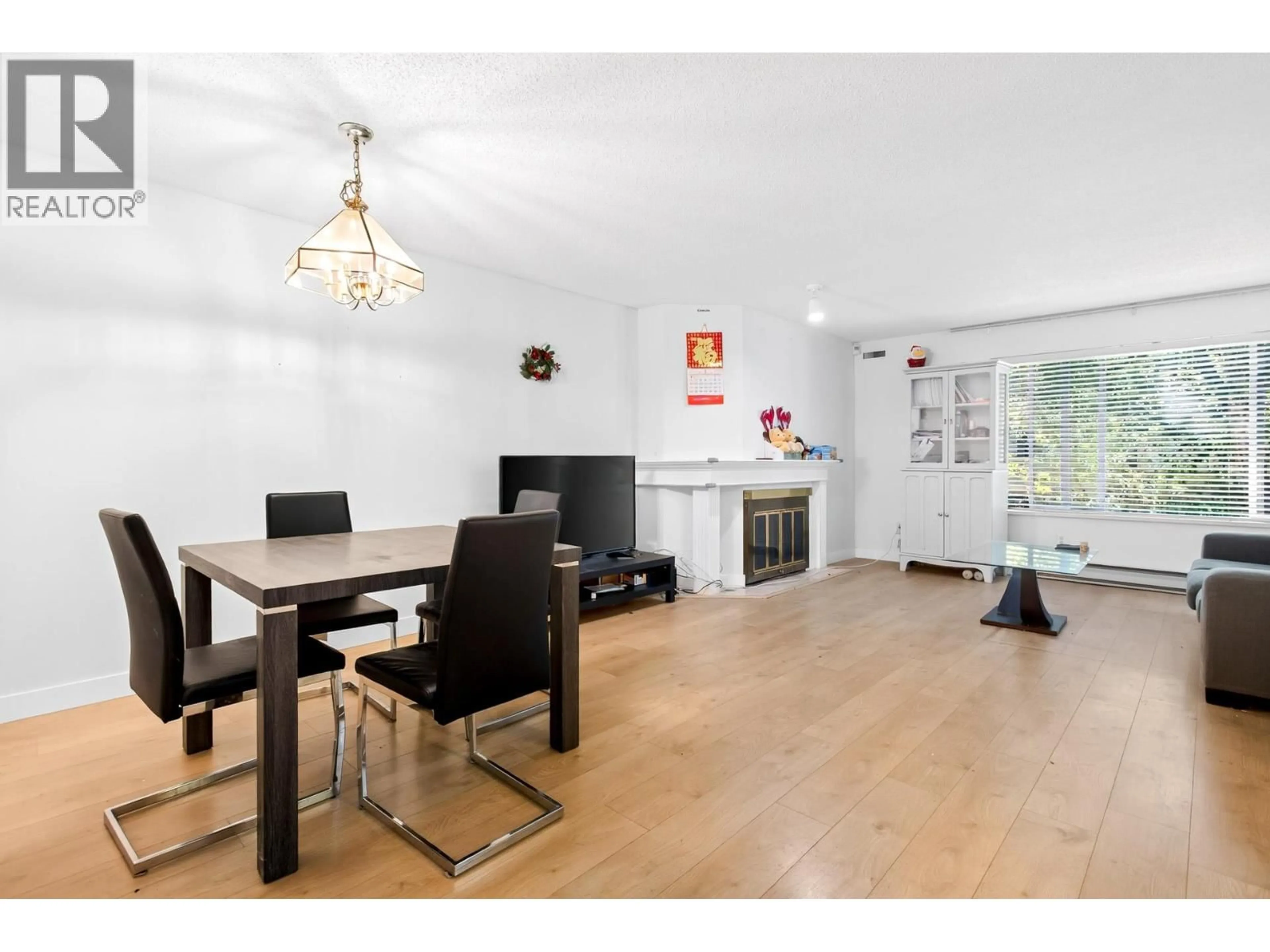 Dining room, wood/laminate floor for 104 - 7560 MOFFATT ROAD, Richmond British Columbia V6Y1X8