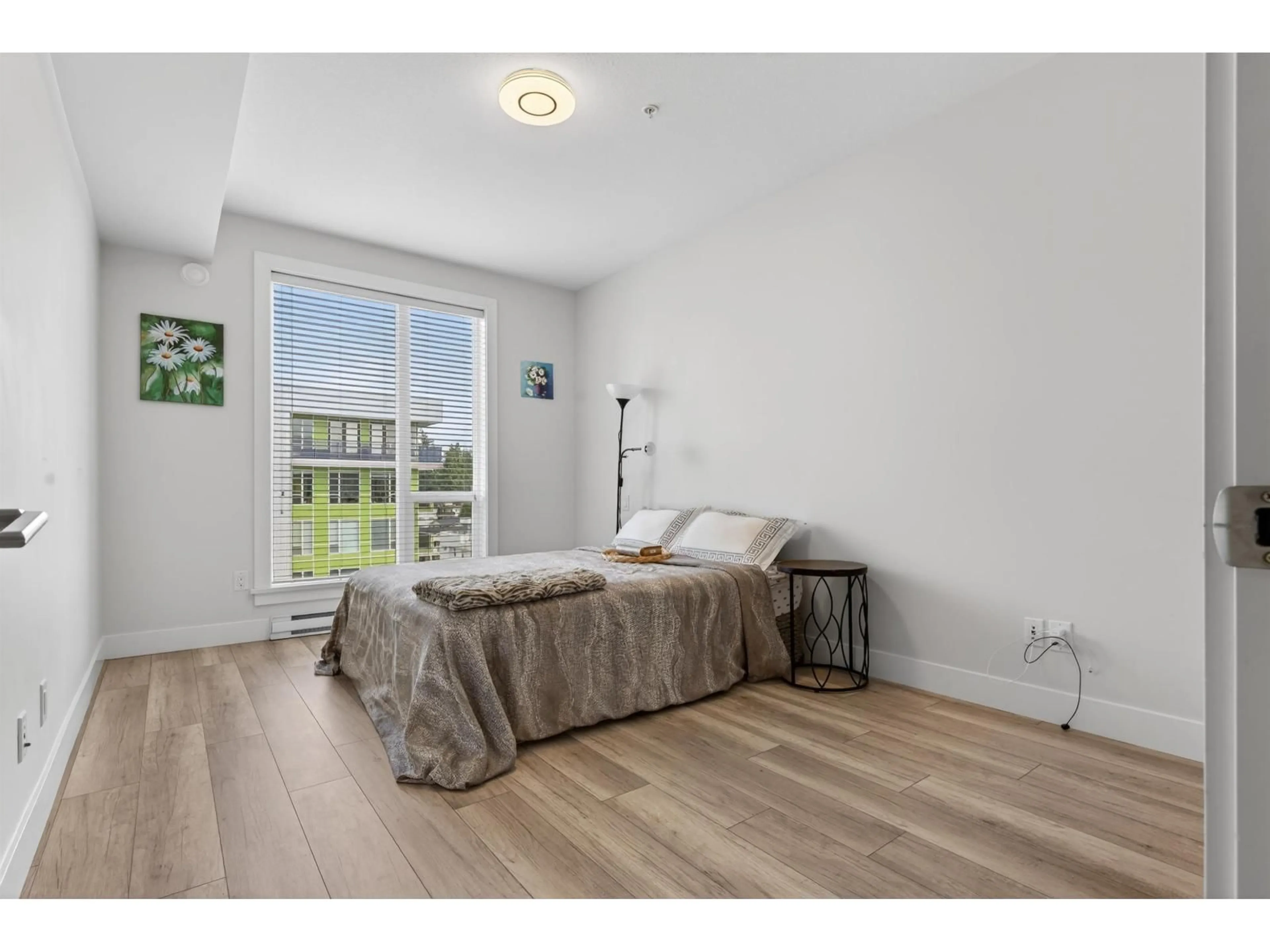 Bedroom with bed, wood/laminate floor for 504 - 2555 WARE STREET, Abbotsford British Columbia V2S0J4