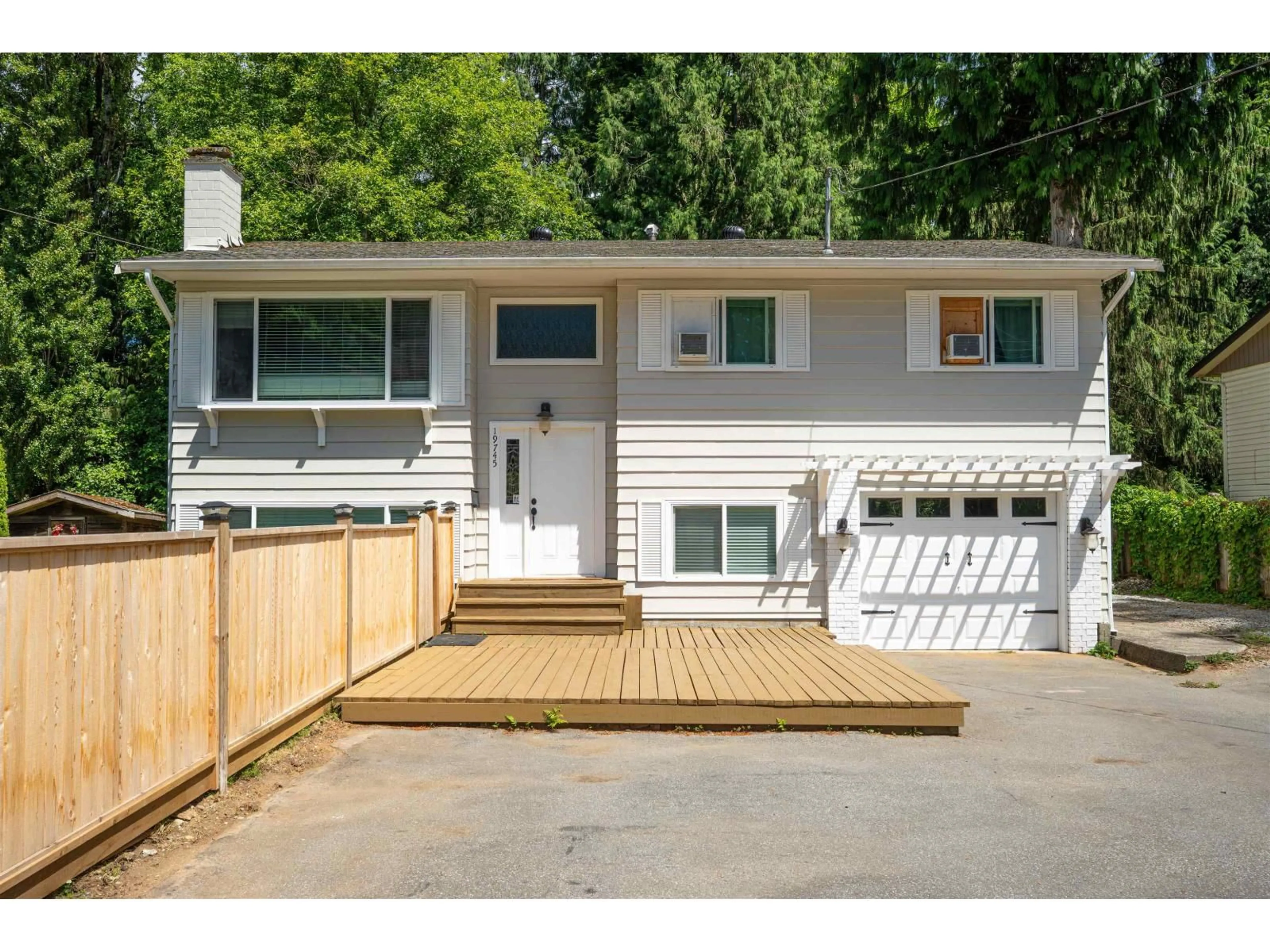 Home with vinyl exterior material, street for 19745 38A AVENUE, Langley British Columbia V3A4W7