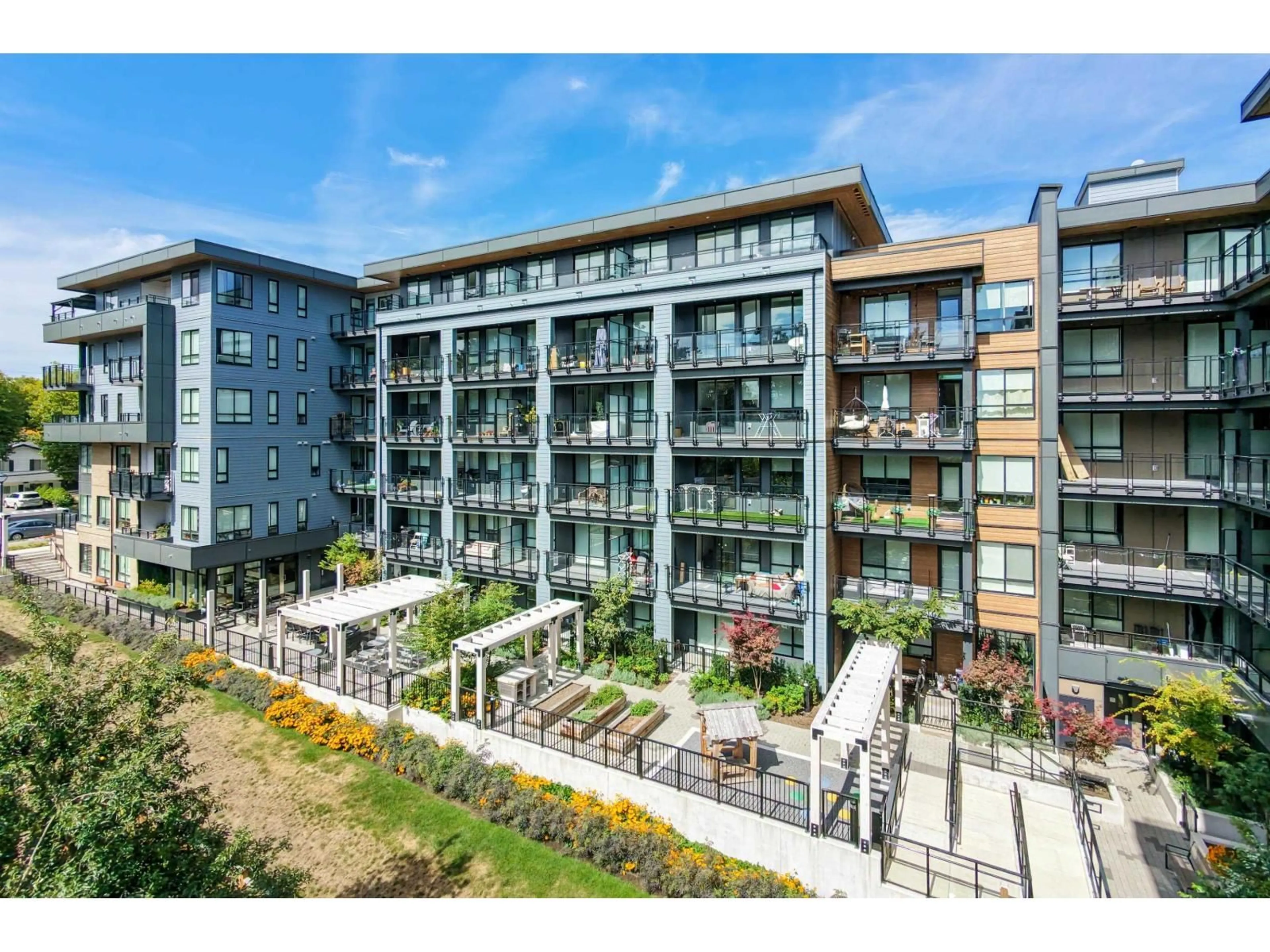 A pic from outside/outdoor area/front of a property/back of a property/a pic from drone, building for 105 - 13439 94A AVENUE, Surrey British Columbia V3V0G9