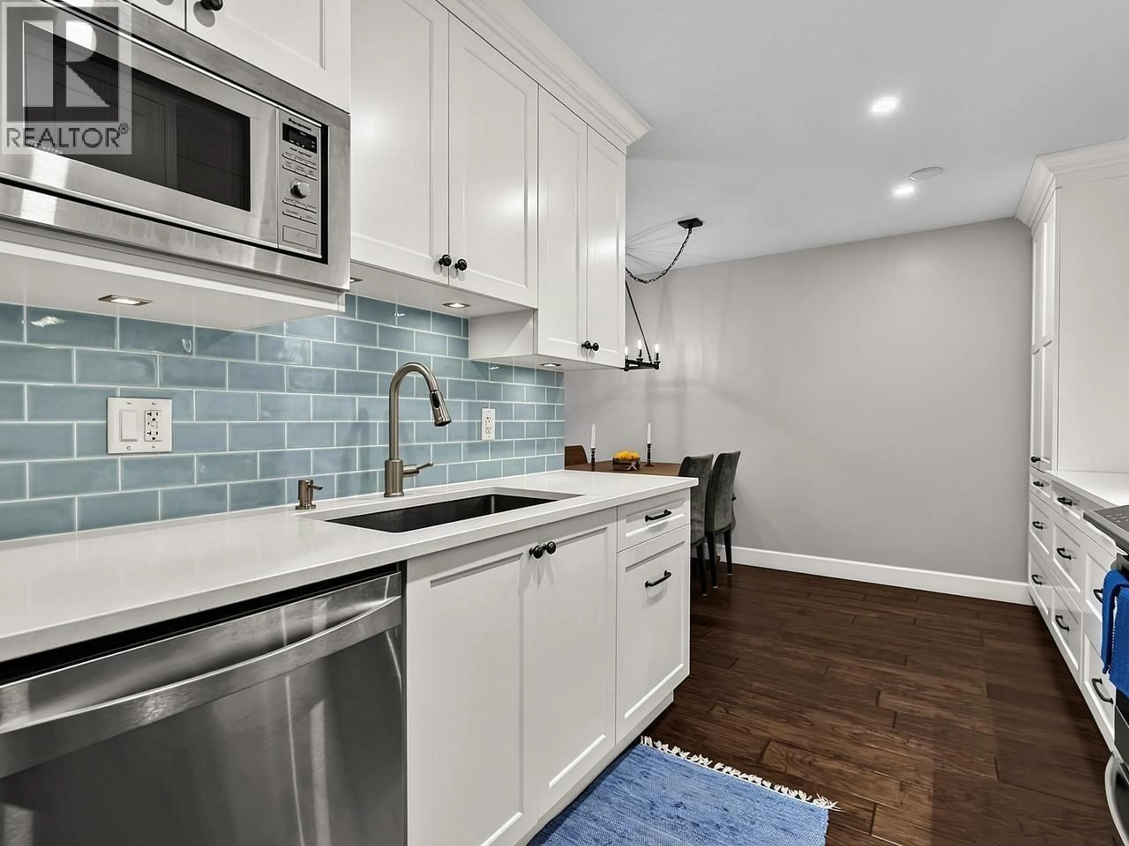 Open concept kitchen, ceramic/tile floor for 205 - 150 5TH STREET, North Vancouver British Columbia V7L1L5