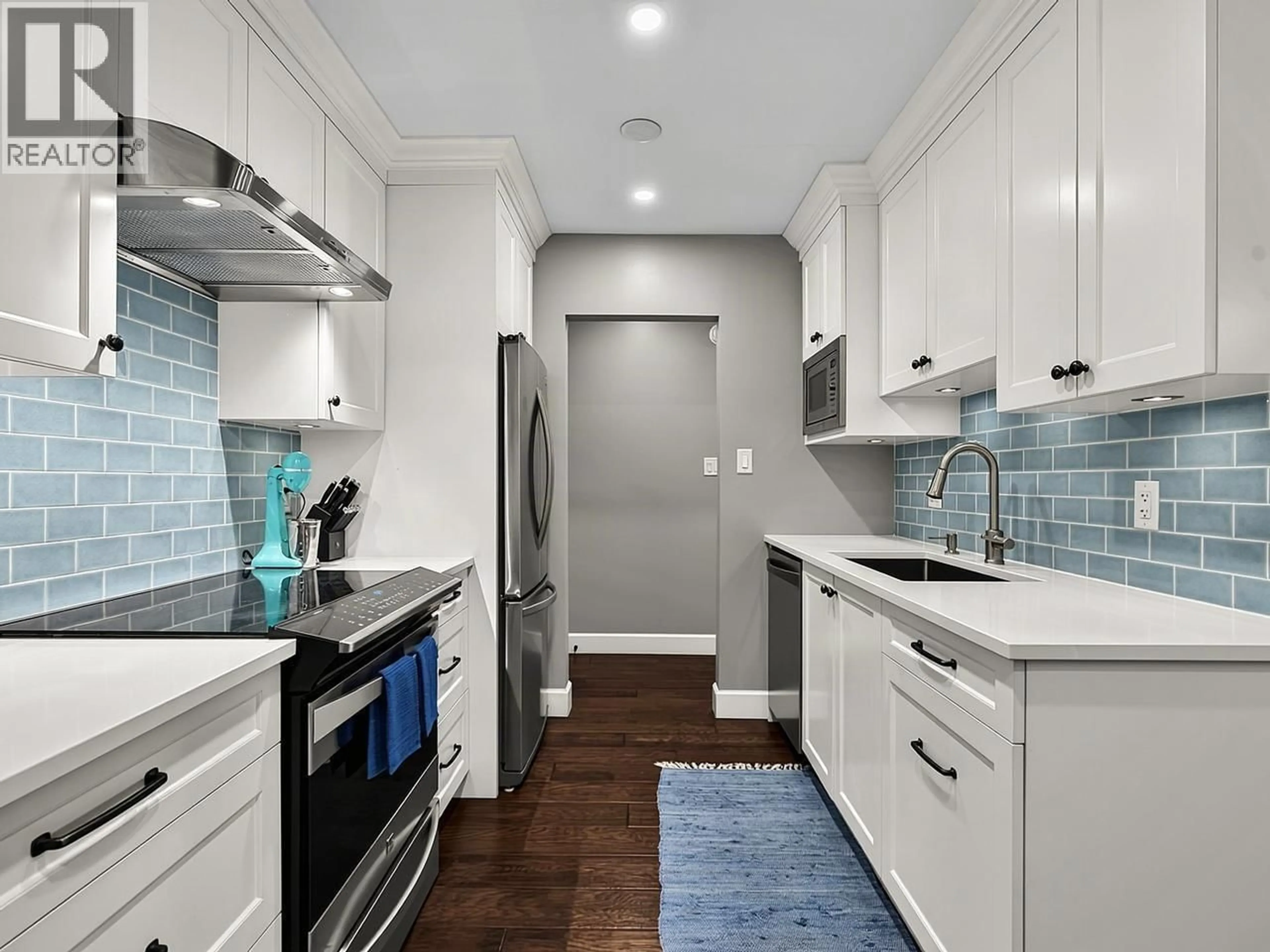 Contemporary kitchen, ceramic/tile floor for 205 - 150 5TH STREET, North Vancouver British Columbia V7L1L5